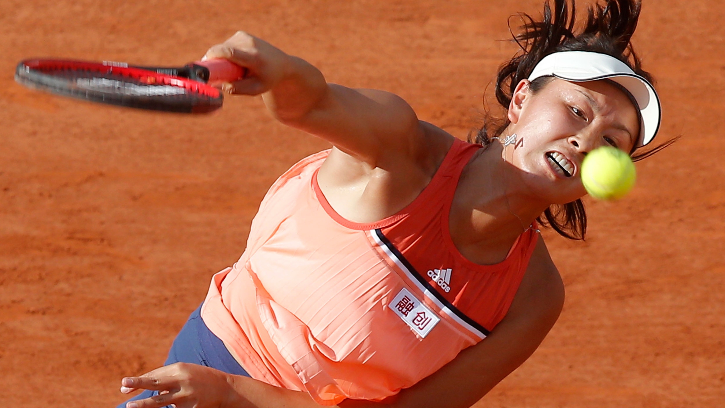 China's Shuai Peng serves the ball to France's Caroline Garcia during their second round match of the French Open tennis tournament at the Roland Garros stadium, Thursday, May 31, 2018, in Paris. China's Shuai Peng serves the ball to France's Caroline Garcia during their second round match of the French Open tennis tournament at the Roland Garros stadium, Thursday, May 31, 2018, in Paris.