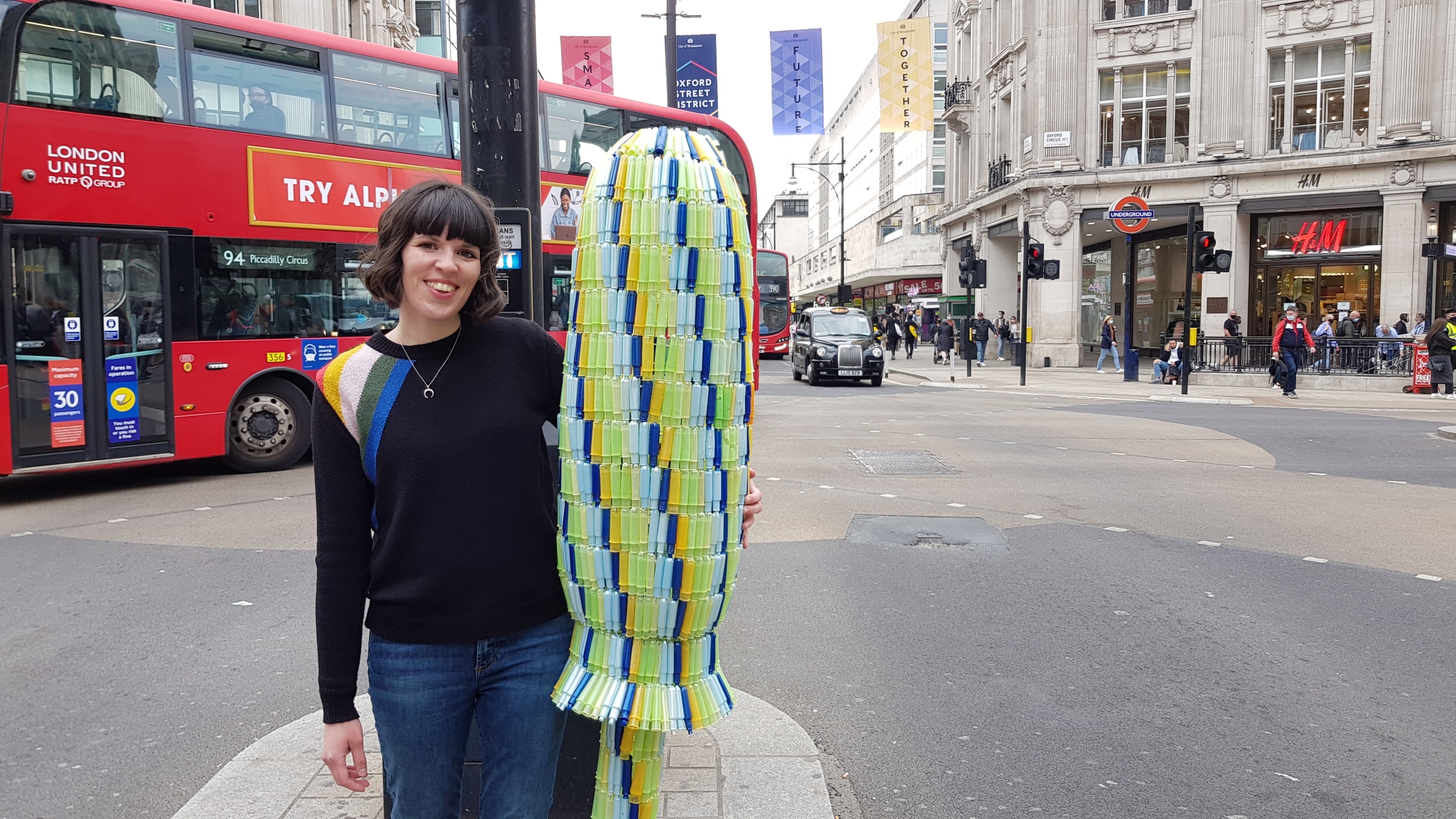 UK environmental activist Ella Daish is shown with the giant tampon she made out of over a thousand used tampons. UK environmental activist Ella Daish is shown with the giant tampon she made out of over a thousand used tampons.