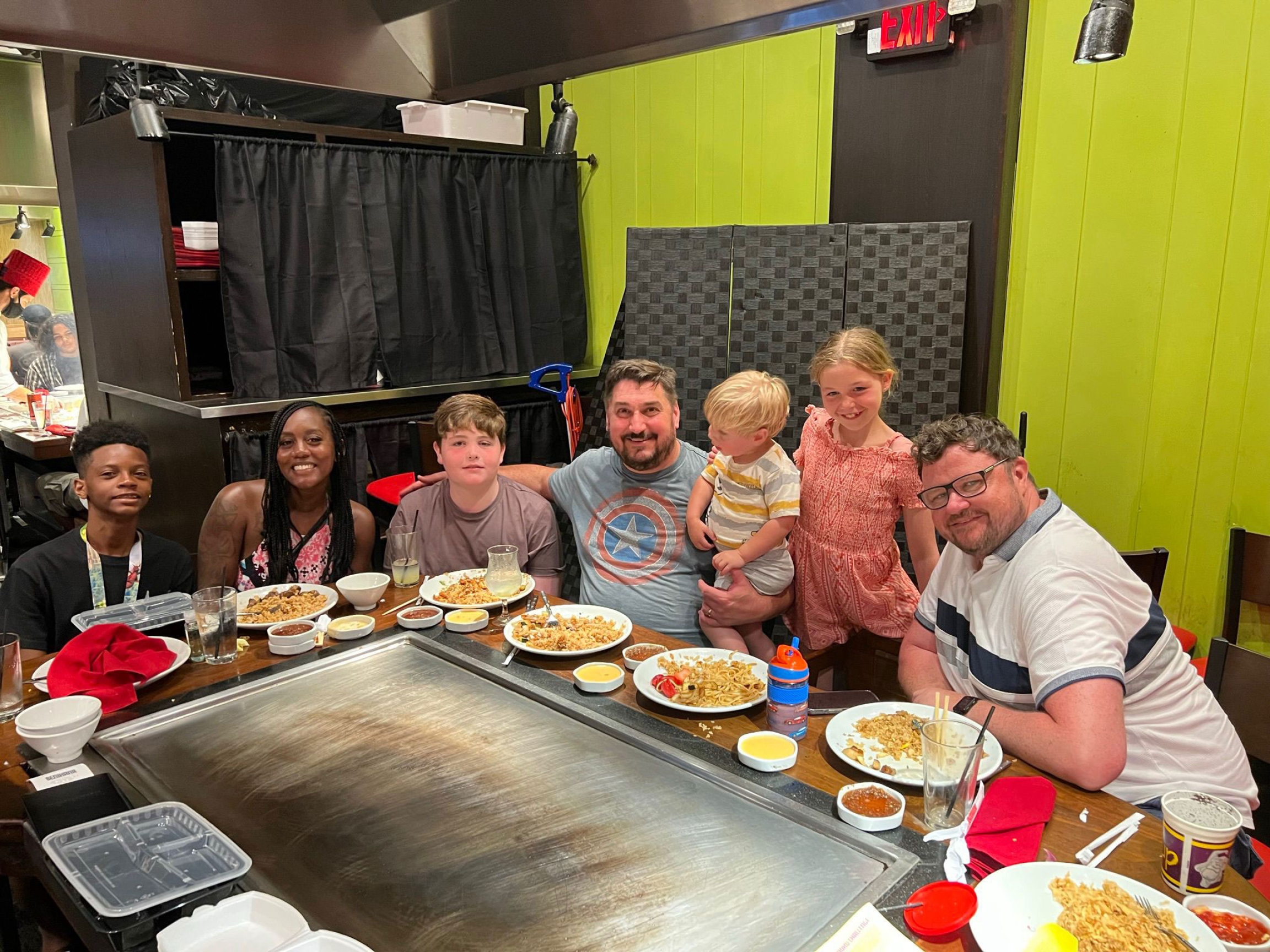 The family having dinner with their surrogate and her son in Florida in 2022. The family having dinner with their surrogate and her son in Florida in 2022.