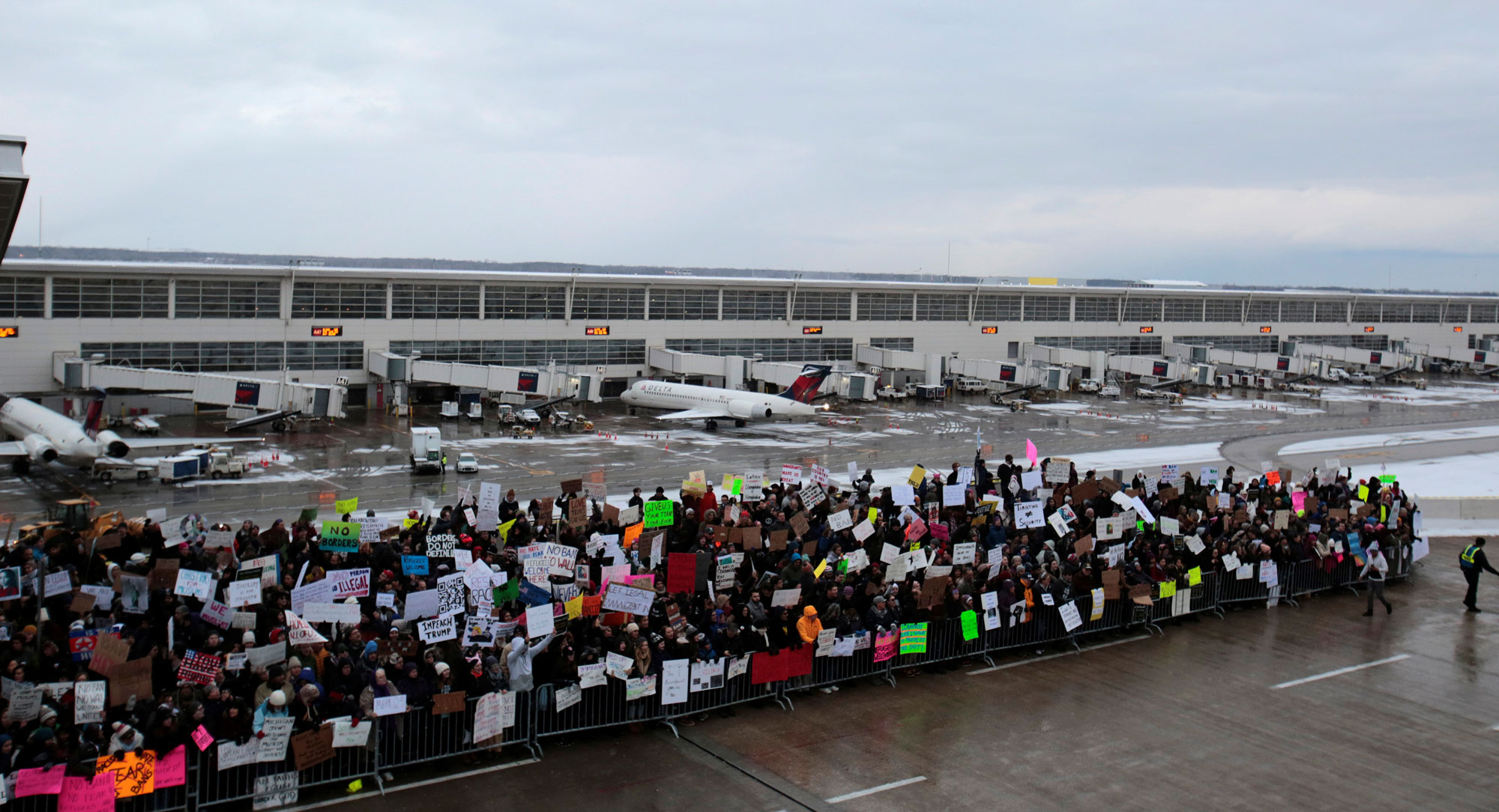 Hundreds of people rally against a travel ban signed by President Donald Trump at Detroit Metropolitan airport. Hundreds of people rally against a travel ban signed by President Donald Trump at Detroit Metropolitan airport.