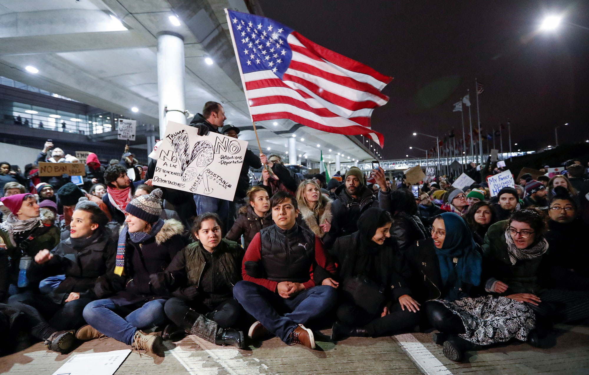 People gather to protest against the travel ban imposed by President Donald Trump's executive order, at O'Hare airport in Chicago. People gather to protest against the travel ban imposed by President Donald Trump's executive order, at O'Hare airport in Chicago.