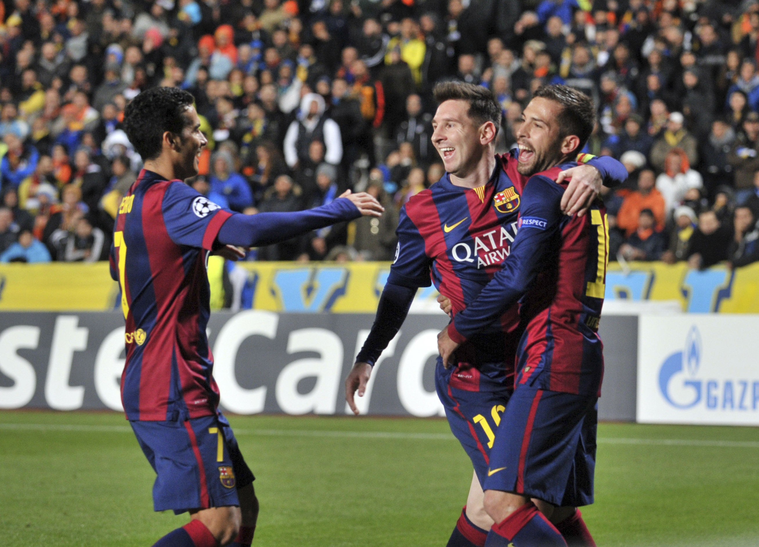Lionel Messi celebrates with teammates after his record-breaking goal. Lionel Messi celebrates with teammates after his record-breaking goal.