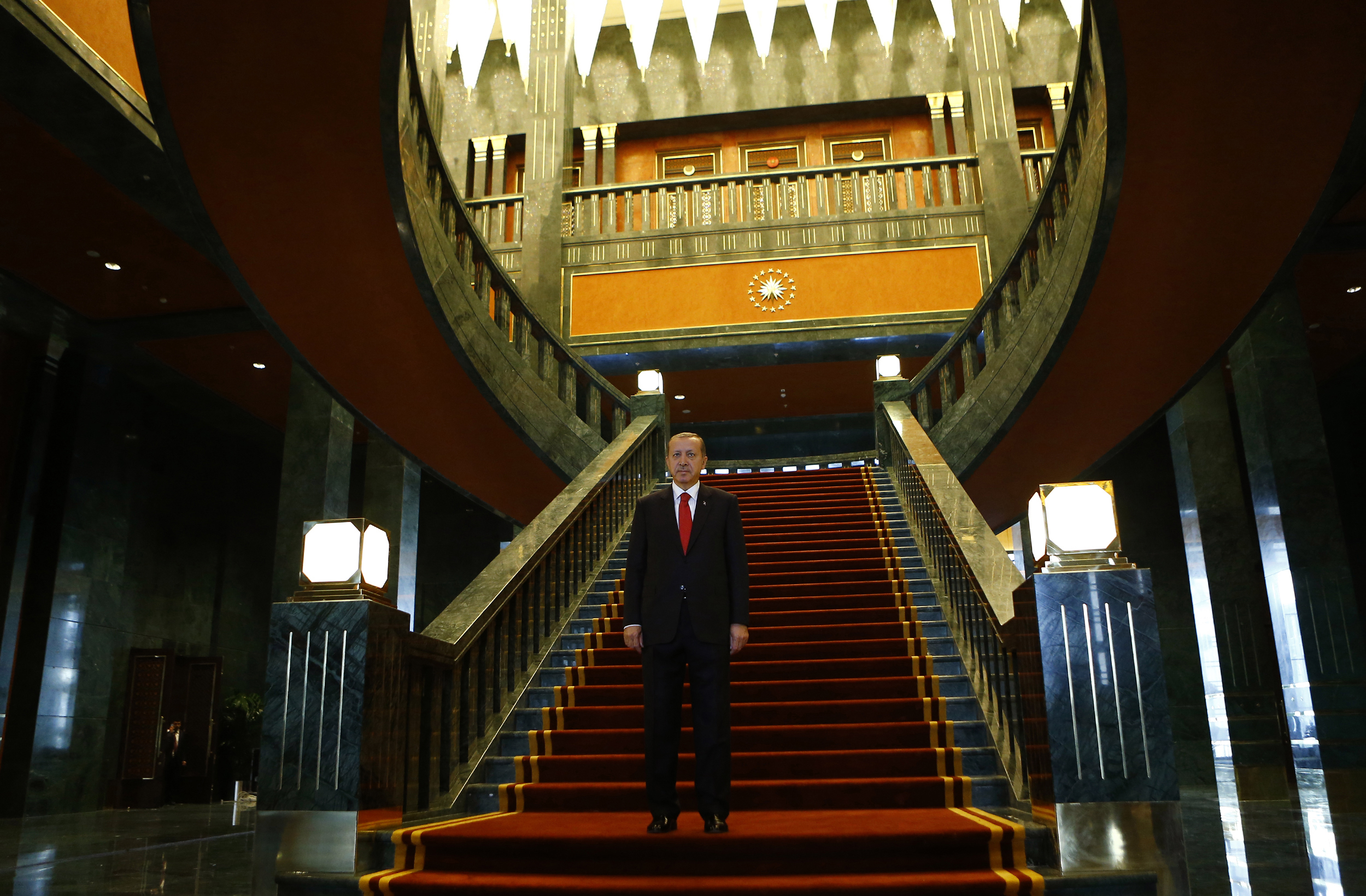 Turkey's President Tayyip Erdogan poses after an official ceremony to mark Republic Day at the new Presidential Palace in Ankara October 29, 2014. Turkey's President Tayyip Erdogan poses after an official ceremony to mark Republic Day at the new Presidential Palace in Ankara October 29, 2014.