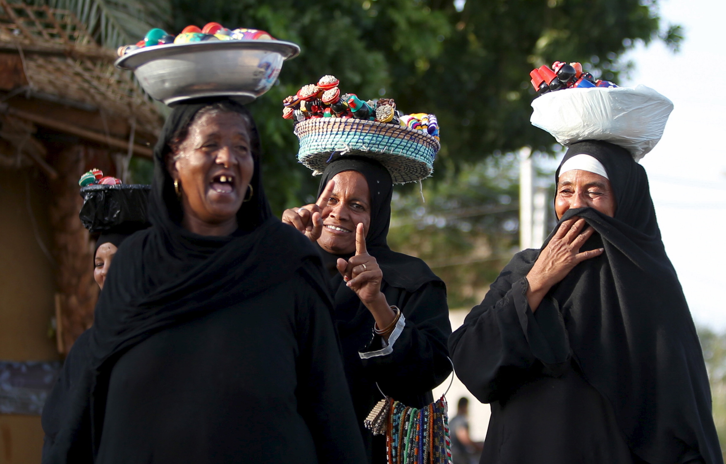 Nubian women sell traditional crafts at the Nubian Gharb Suheil village, near Aswan. Nubian women sell traditional crafts at the Nubian Gharb Suheil village, near Aswan.