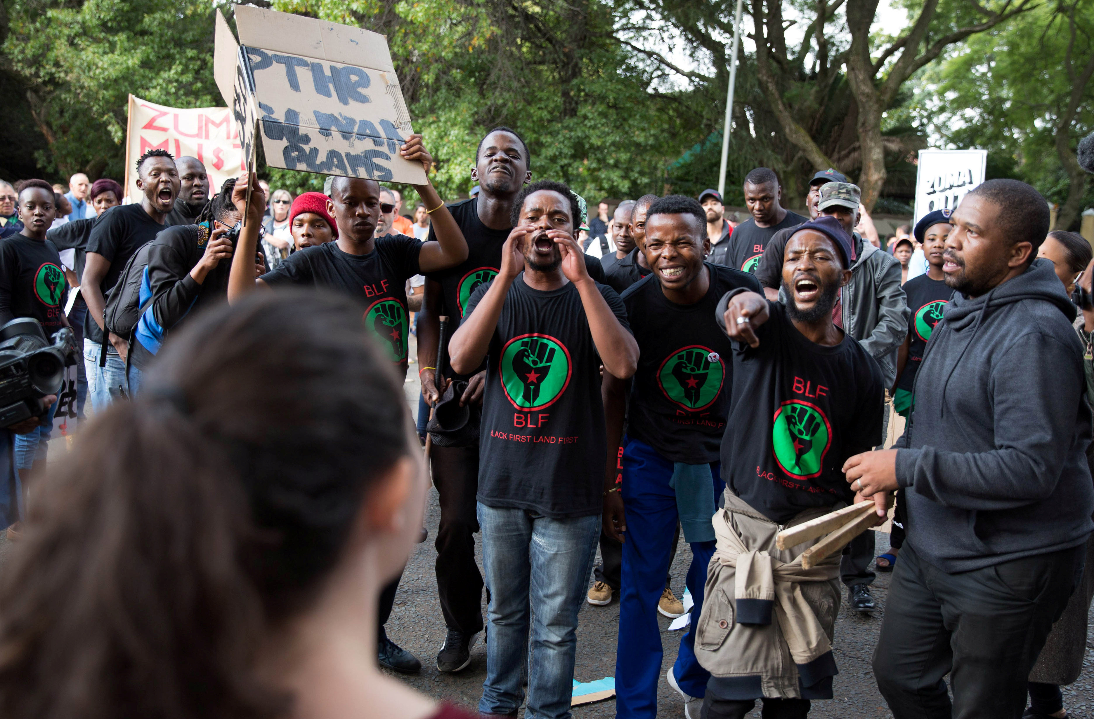 Supporters of President Jacob Zuma confront demonstrators calling for Zuma's removal outside the home of the controversial Gupta family in Johannesburg, South. Supporters of President Jacob Zuma confront demonstrators calling for Zuma's removal outside the home of the controversial Gupta family in Johannesburg, South.