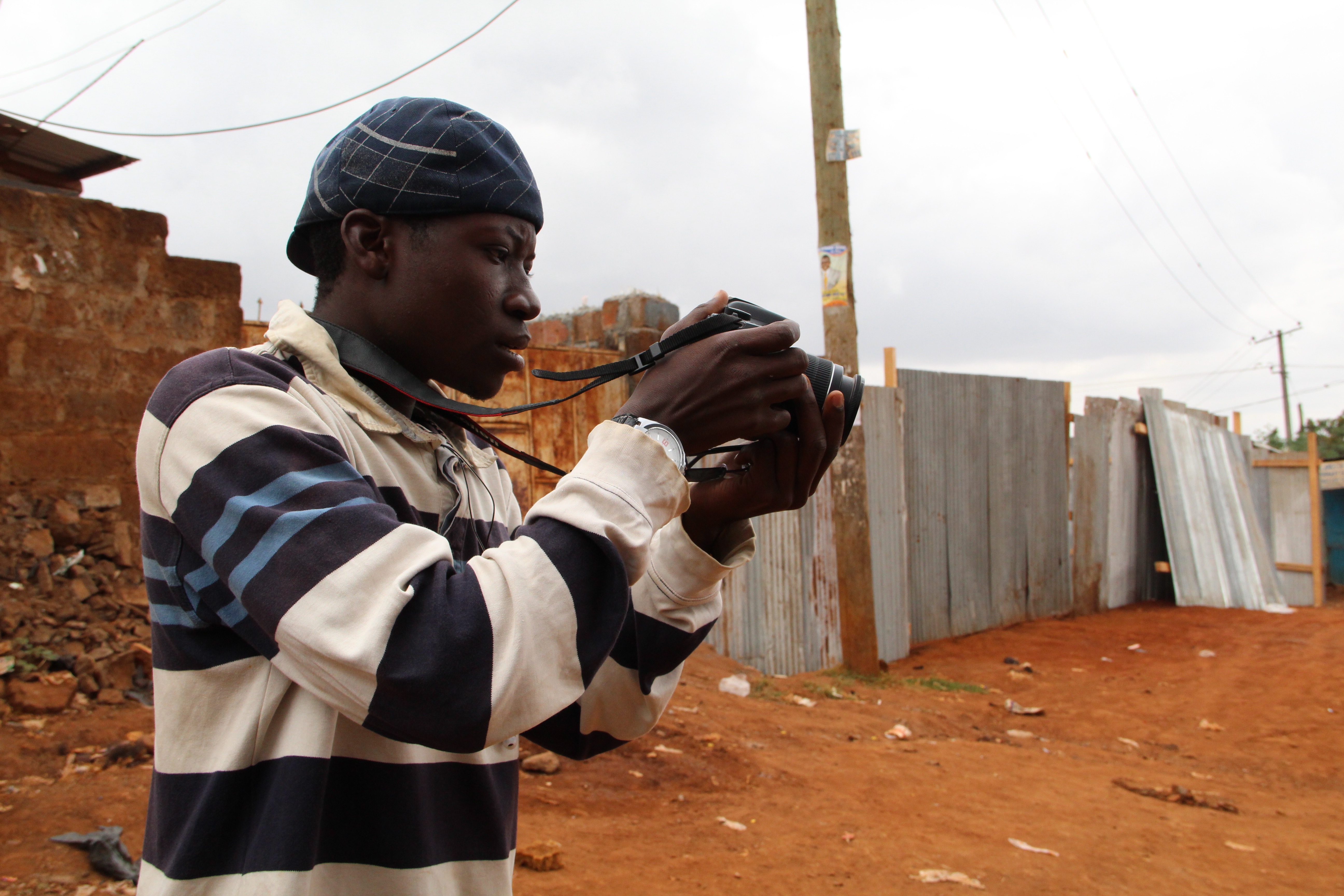 Abbas practices taking pictures with Habari Kibra's only camera. His true passion, though, is making radio. Abbas practices taking pictures with Habari Kibra's only camera. His true passion, though, is making radio.
