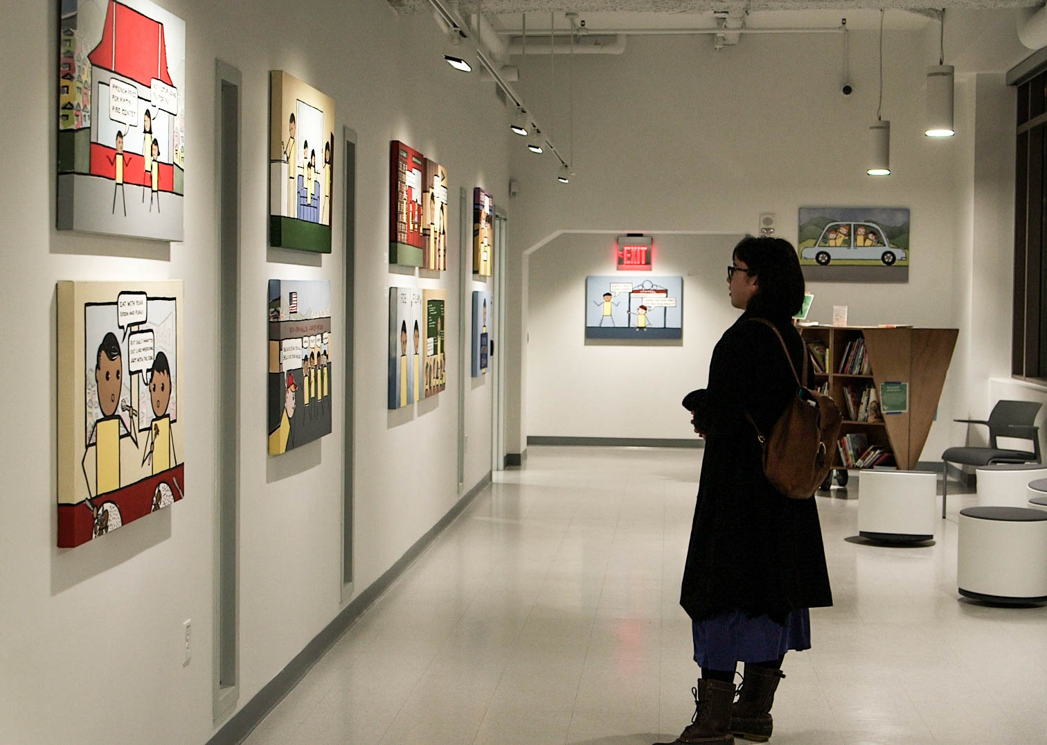 A woman looks at the exhibit, "Kulap: New Works by Bren Bataclan" at the BCNC Pao Arts Center in Boston. A woman looks at the exhibit, "Kulap: New Works by Bren Bataclan" at the BCNC Pao Arts Center in Boston.