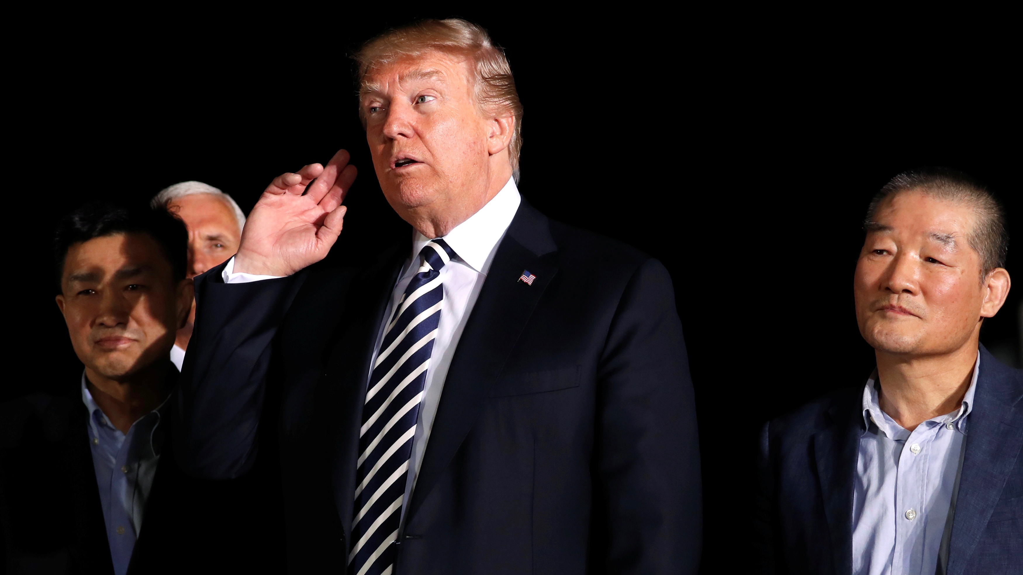US President Donald Trump listens to question from reporters as he meets the three Americans released from detention in North Korea upon their arrival at Joint Base Andrews in Marylandon May 10, 2018.
