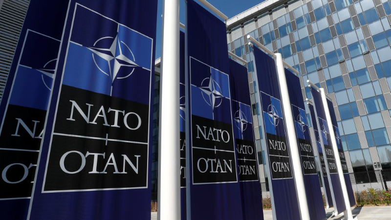 Banners displaying the NATO logo are placed at the entrance of new NATO headquarters, in Brussels. Banners displaying the NATO logo are placed at the entrance of new NATO headquarters, in Brussels.