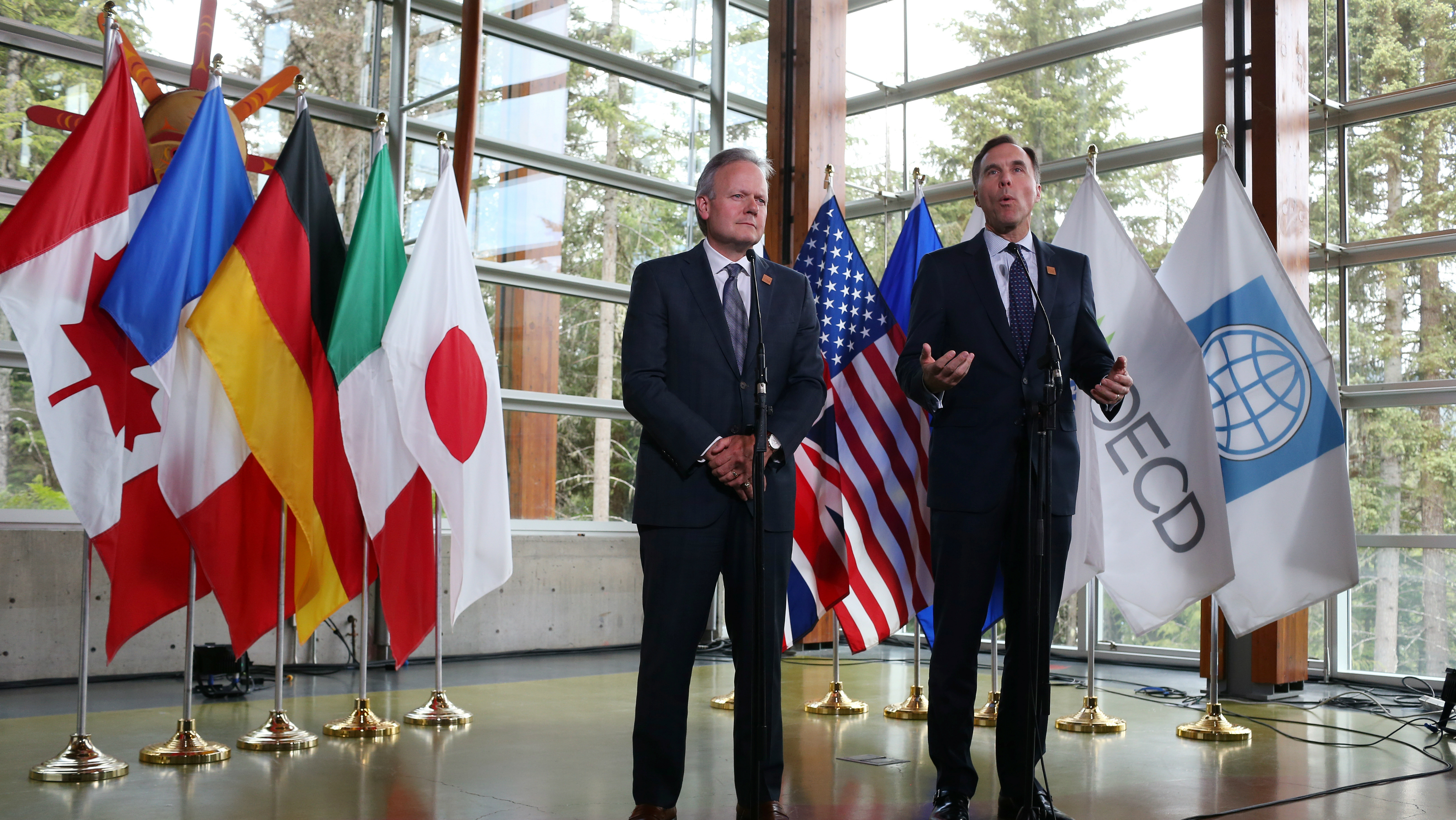 Governor of the Bank of Canada Stephen Poloz, left, and Canada's Minister of Finance Bill Morneau hold a news conference after the G7 Finance Ministers Summit in Whistler, British Columbia, Canada, June 2, 2018.