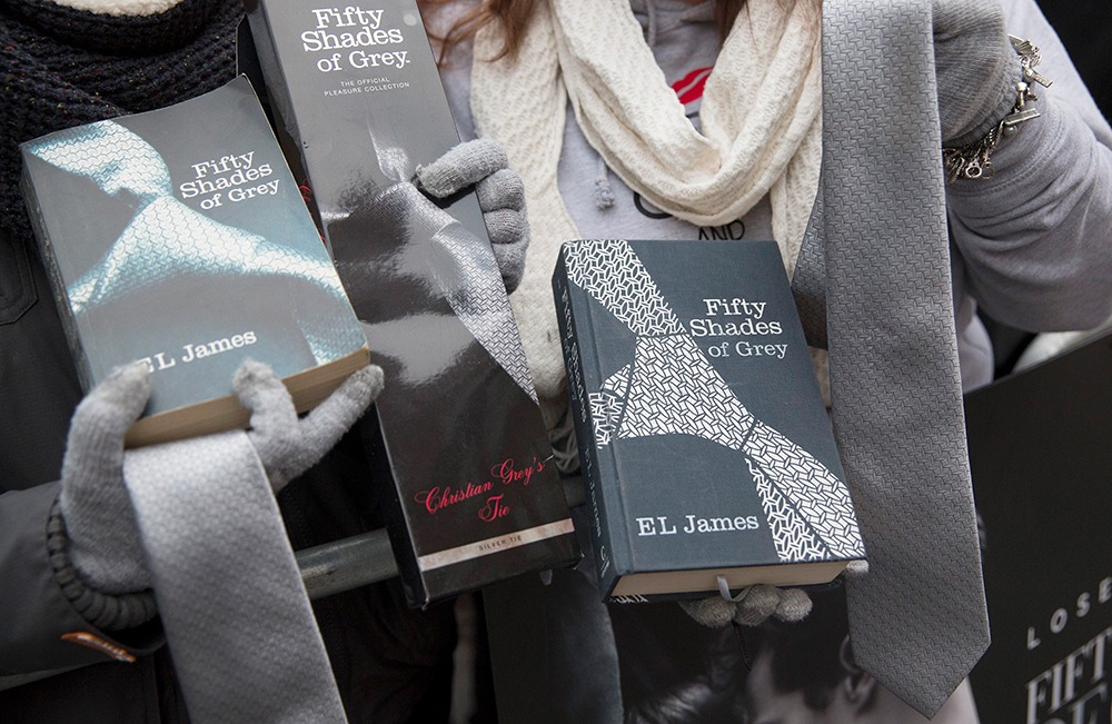 Fans pose with "Fifty Shades of Grey" paraphernalia at the film's UK premiere in London in 2015. Fans pose with "Fifty Shades of Grey" paraphernalia at the film's UK premiere in London in 2015.