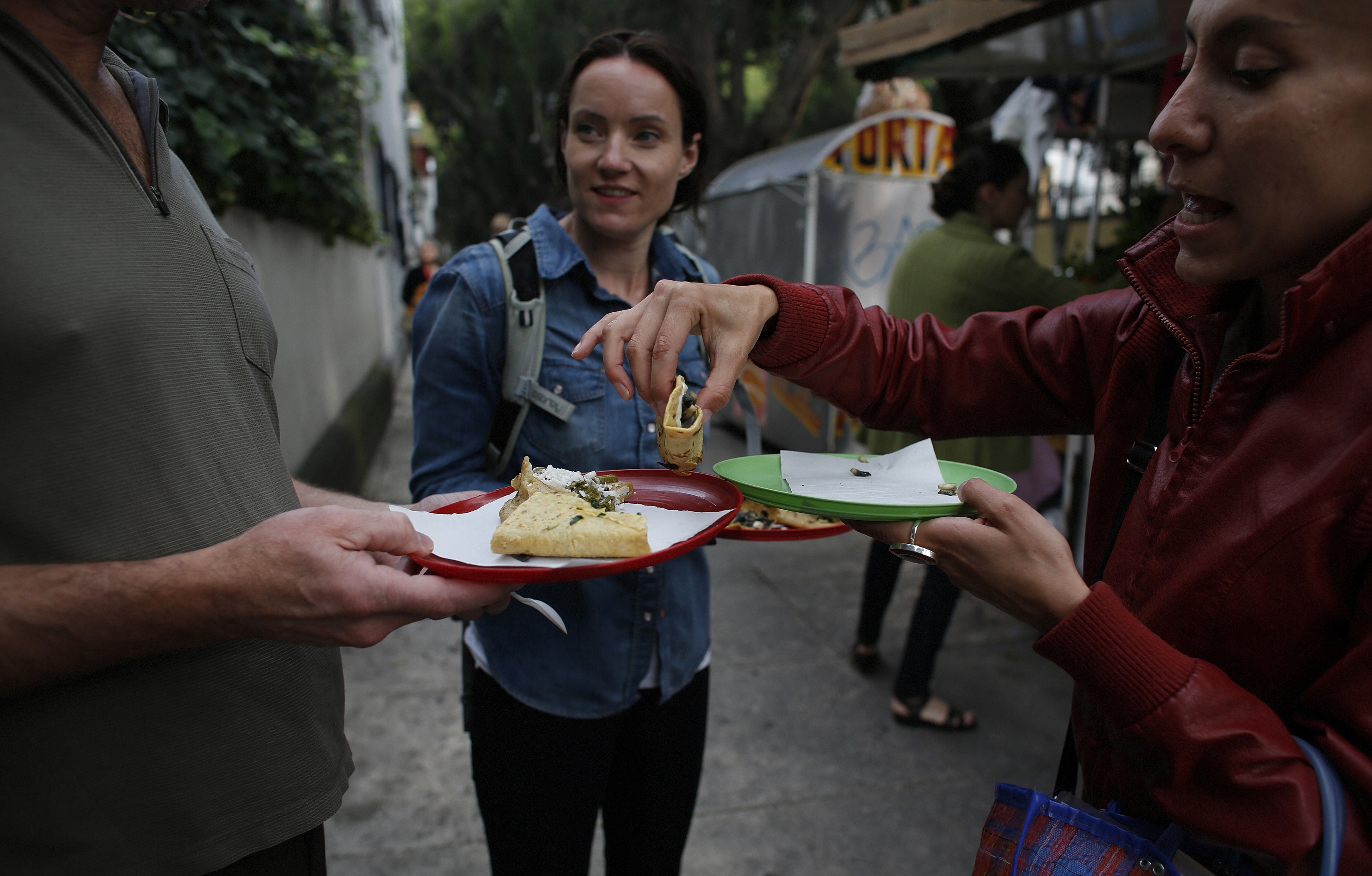 three people split quesadillas