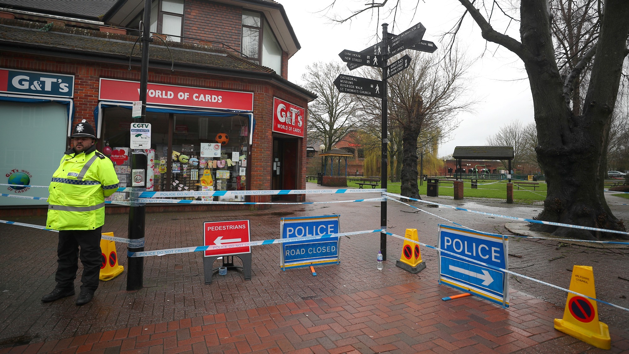 A police officer guards a cordoned off area in the city center where former Russian intelligence officer Sergei Skripal and his daughter Yulia were found poisoned, in Salisbury, Britain, April 2018. A police officer is shown standing to the left of the photograph, wearing a fluorescent jacket guards a cordoned off area where former Russian intelligence officer Sergei Skripal and his daughter Yulia were found poisoned.
