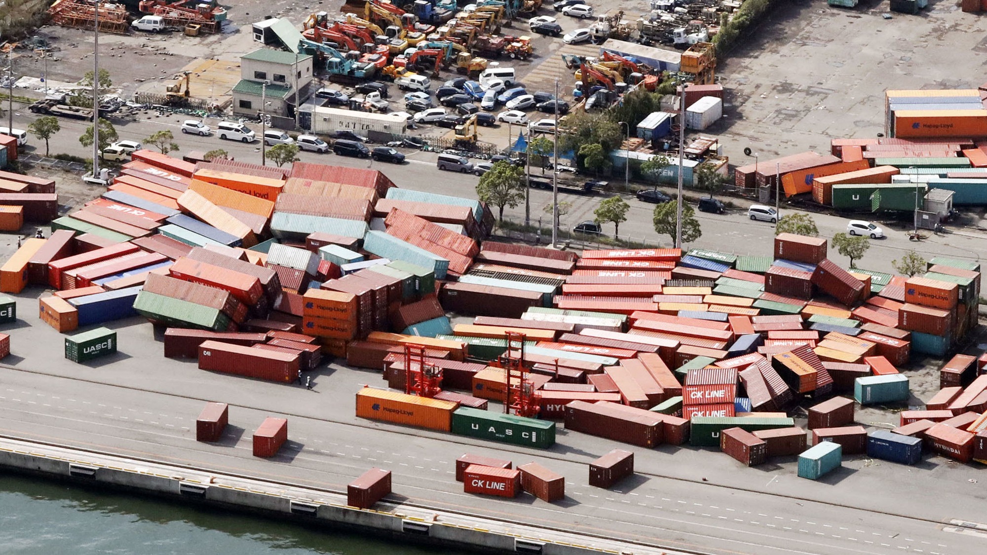 Containers damaged by Typhoon Jebi are seen in Kobe, western Japan, September 5, 2018. Shipping containers are shown fallen over on top of one another damaged by Typhoon Jebi..