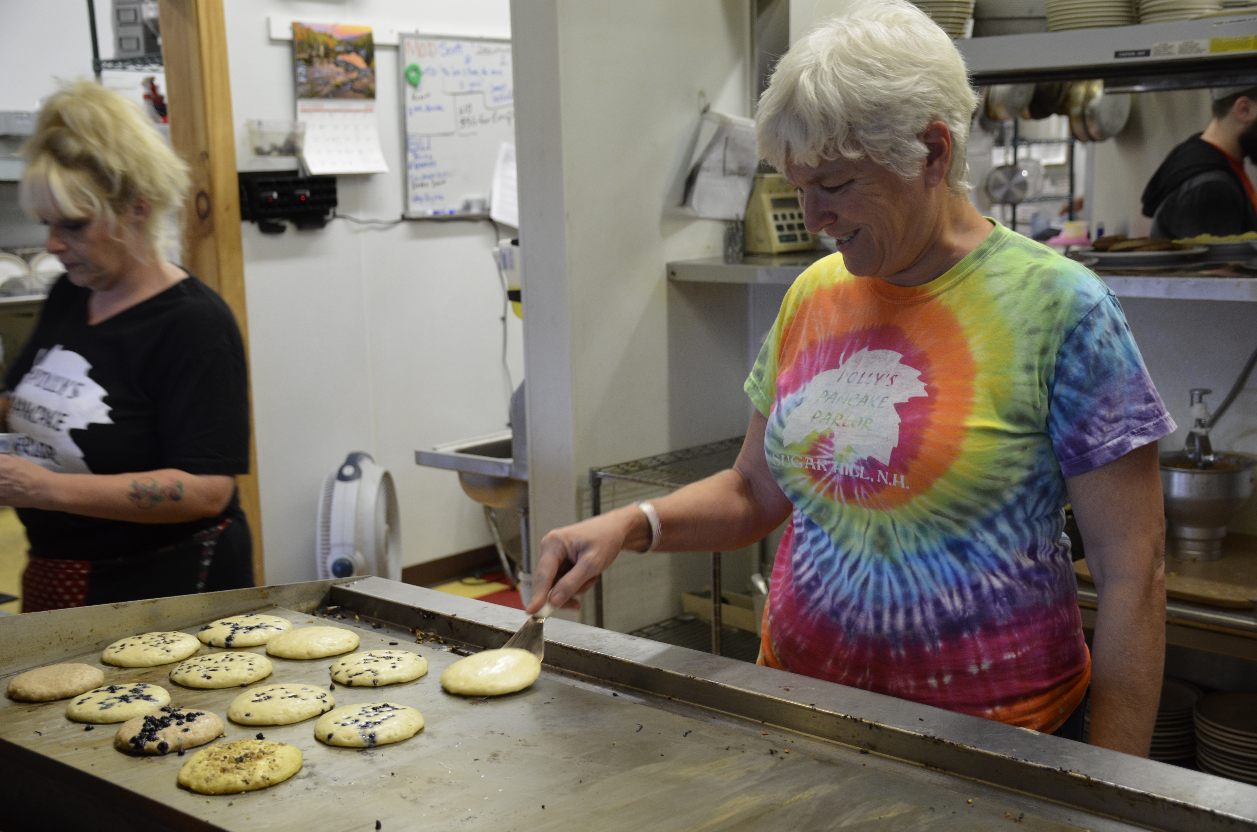 Kathie Aldrich Côté, owner of Polly’s Pancake Parlor, grills up pancakes prepared from homemade batter recipes. Kathie Aldrich Côté, owner of Polly’s Pancake Parlor, grills up pancakes prepared from homemade batter recipes.