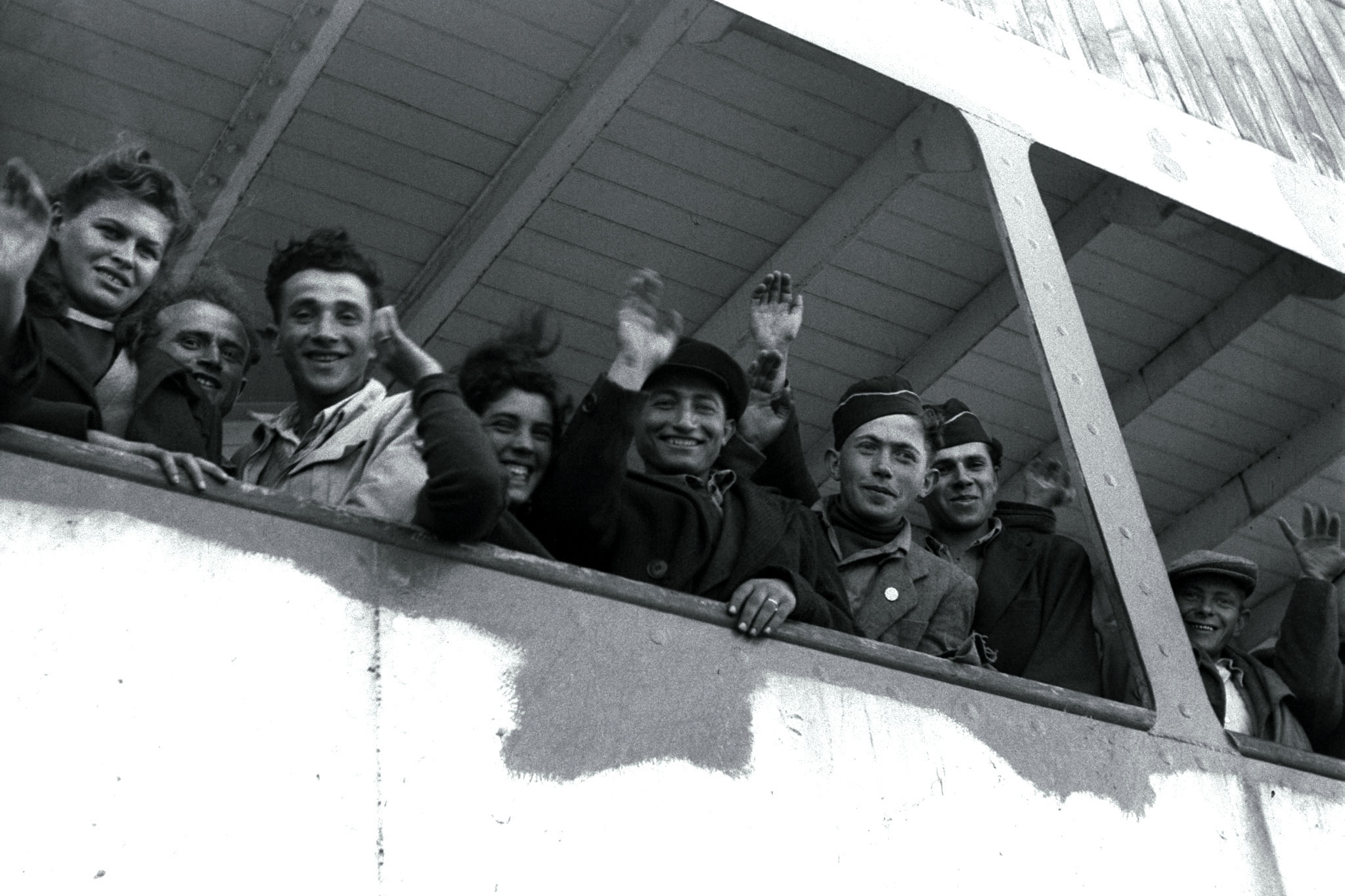 Newly arriving Jewish refugee from the Nazi Holocaust wave from the ship "S.S. Awarea" as it pulls into Haifa port on April 6, 1948. Newly arriving Jewish refugee from the Nazi Holocaust wave from the ship "S.S. Awarea" as it pulls into Haifa port on April 6, 1948.