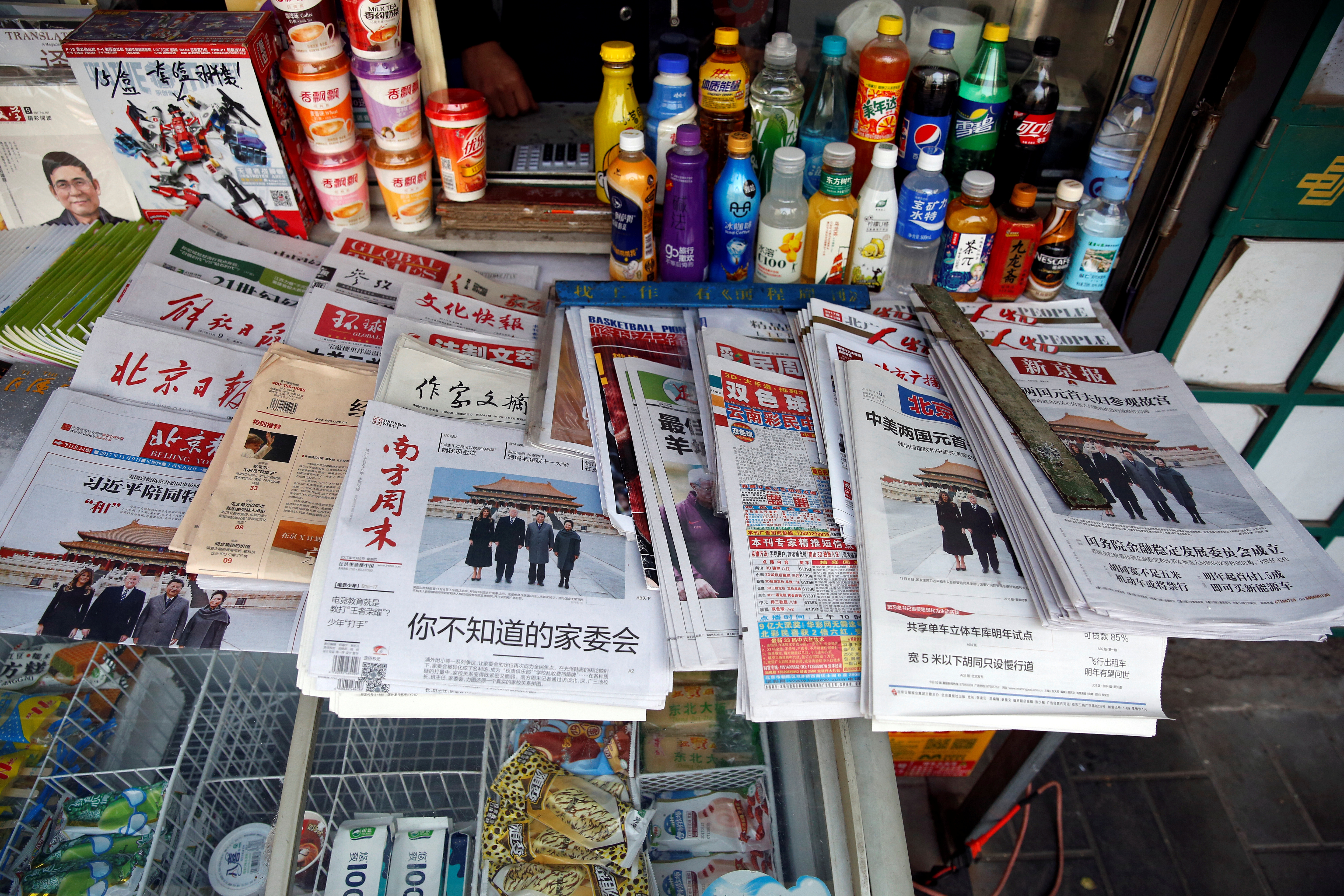 Chinese newspapers featuring a picture of US President Donald Trump a