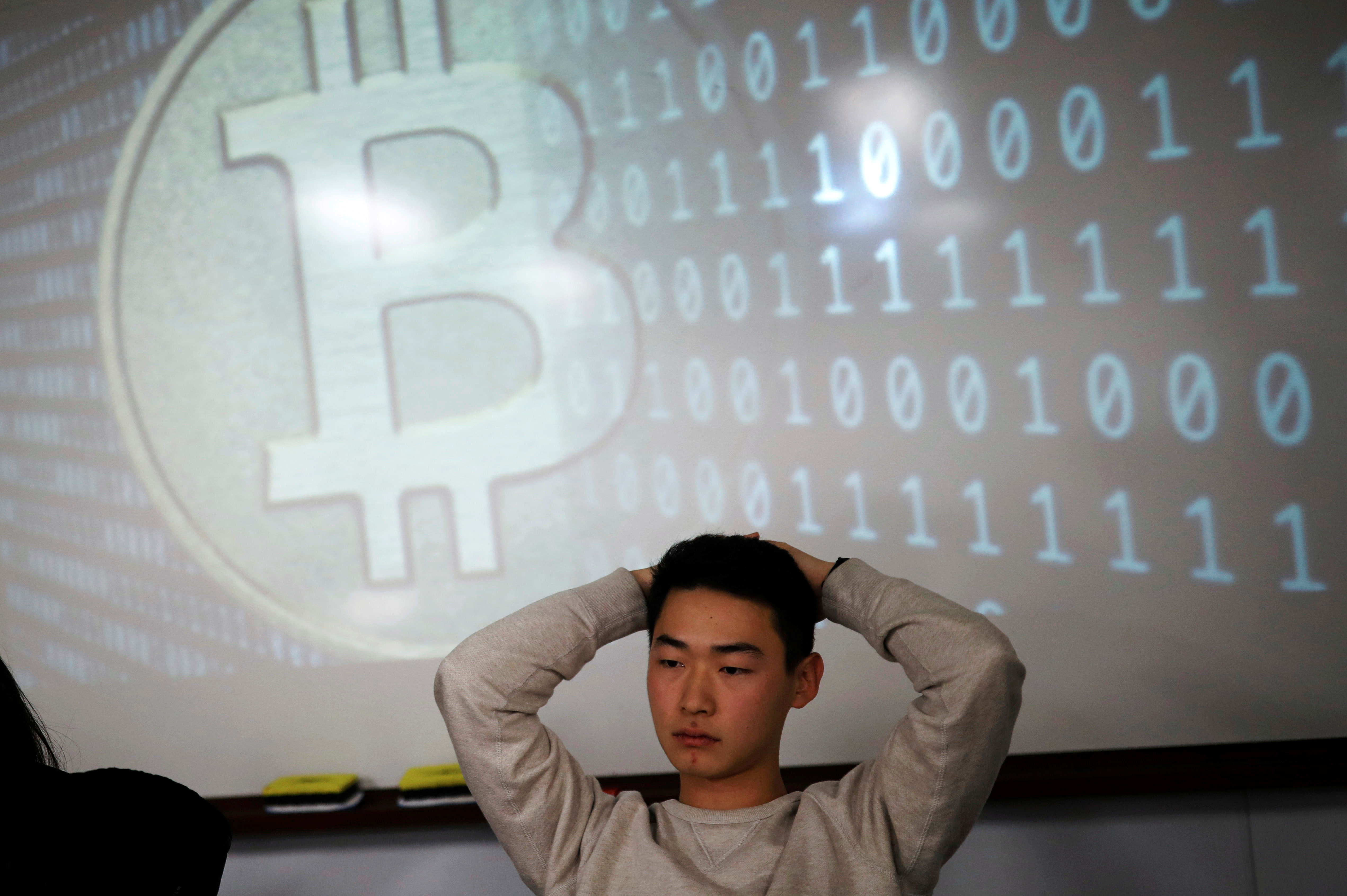 A university student, a member of a club studying cryptocurrencies, attends a meeting at a university in Seoul, South Korea, December 20, 2017. A university student, a member of a club studying cryptocurrencies, attends a meeting at a university in Seoul, South Korea, December 20, 2017.