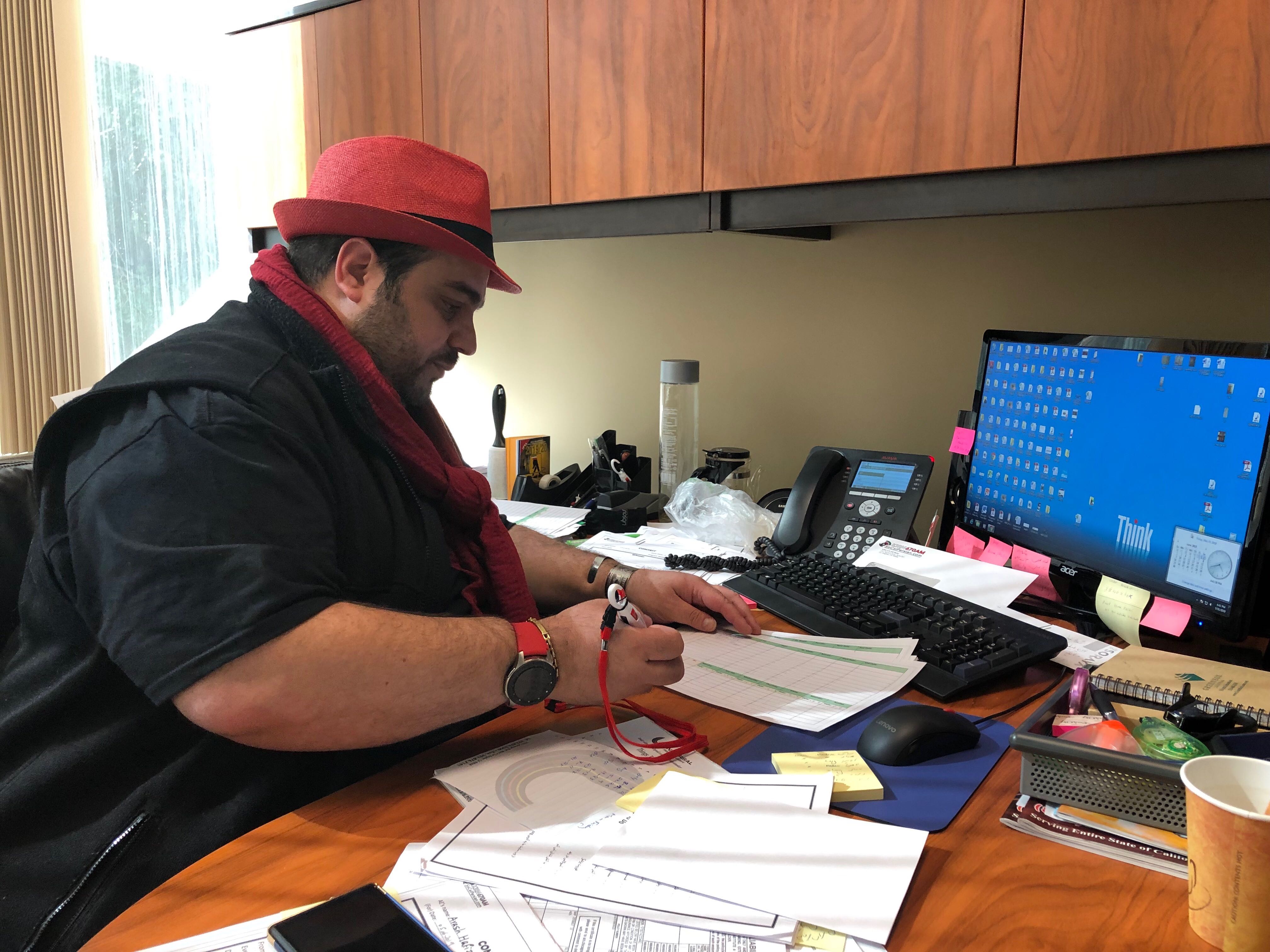 Program director Alireza Hekmatshoar at his office at the KIRN 670 studios in Los Angeles. Program director Alireza Hekmatshoar at his office at the KIRN 670 studios in Los Angeles