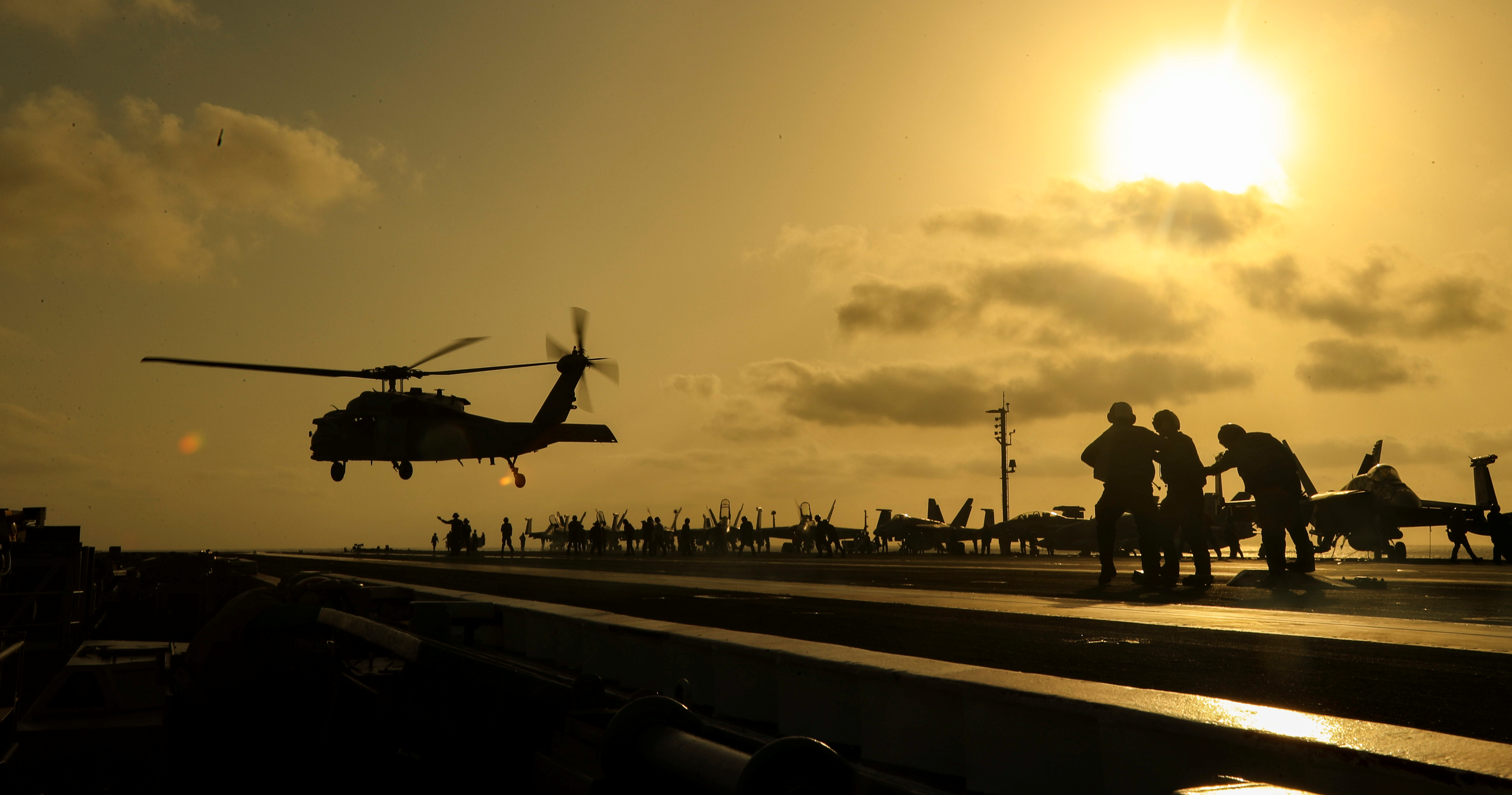 An MH-60S Seahawk helicopter lifts off the flight deck of the US Navy aircraft carrier USS Abraham Lincoln in the Arabian Sea, June 3, 2019. An MH-60S Seahawk helicopter lifts off the flight deck of the US Navy aircraft carrier USS Abraham Lincoln in the Arabian Sea, June 3, 2019.