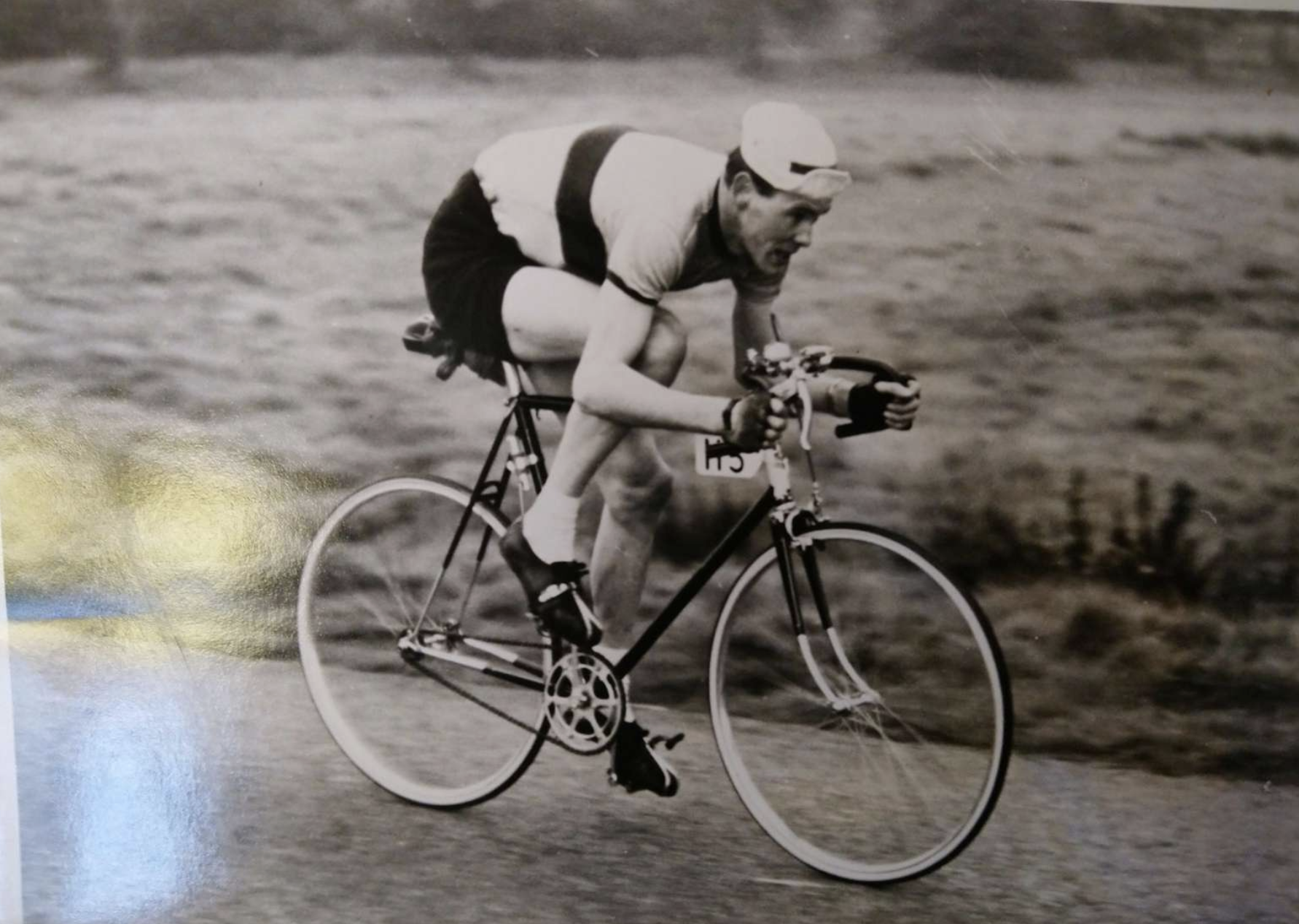 Russ Mantle in 1961. A man on a bicycle on a black and white photo.
