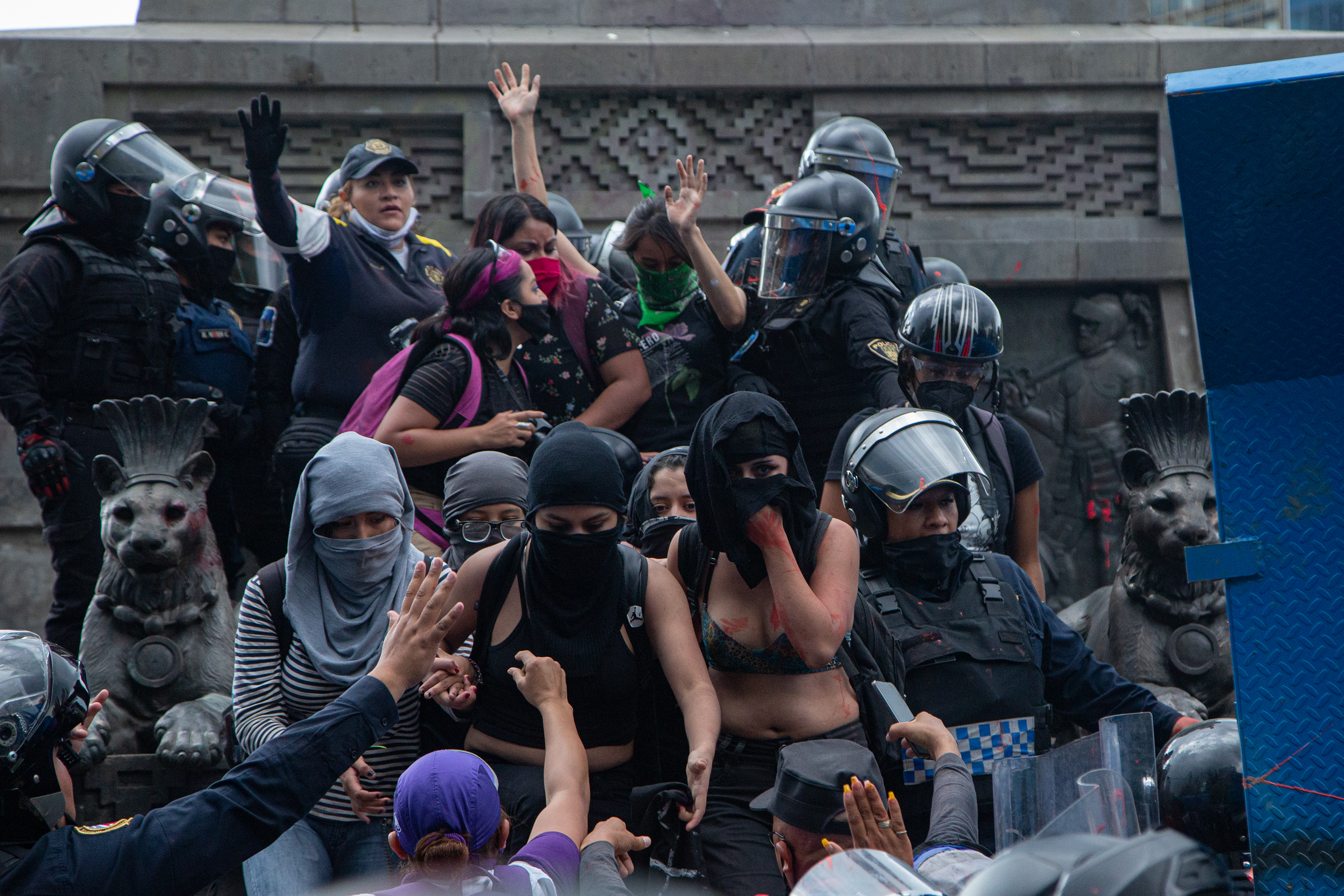 Women protesters face off with Mexican officials.