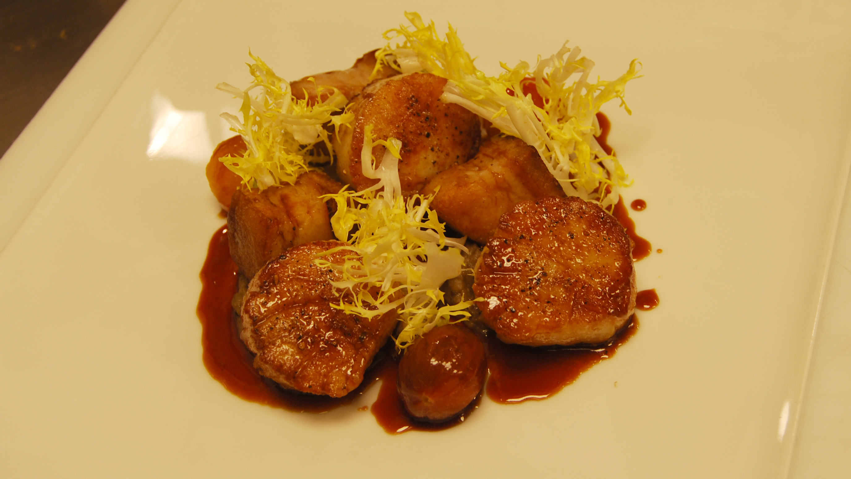 At Andrea's, an Asian fusion restaurant at the five-star Wynn & Encore Resort on the Las Vegas Strip, pan-seared diver scallops with eggplant puree highlight Filipino cuisine. Chef Joseph Elevado says Filipinos are his biggest fans - and critics. At Andrea's, an Asian fusion restaurant at the five-star Wynn & Encore Resort on the Las Vegas Strip, pan-seared diver scallops with eggplant puree highlight Filipino cuisine. Chef Joseph Elevado says Filipinos are his biggest fans - and critics.