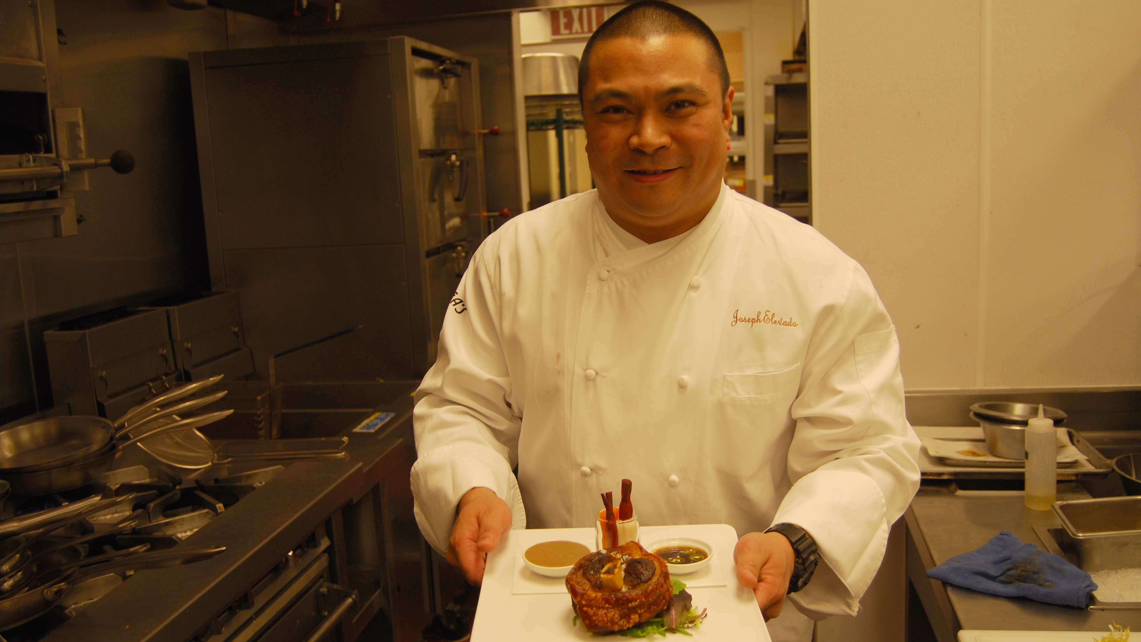 Joseph Elevado, head chef at Andrea's, holds a plate of crispy pork shank known as pata, a dish served Filipino style. His menu offers a variety of Asian dishes including Chinese, Japanese, Thai and Filipino foods. Joseph Elevado, head chef at Andrea's, holds a plate of crispy pork shank known as pata, a dish served Filipino style. His menu offers a variety of Asian dishes including Chinese, Japanese, Thai and Filipino foods.
