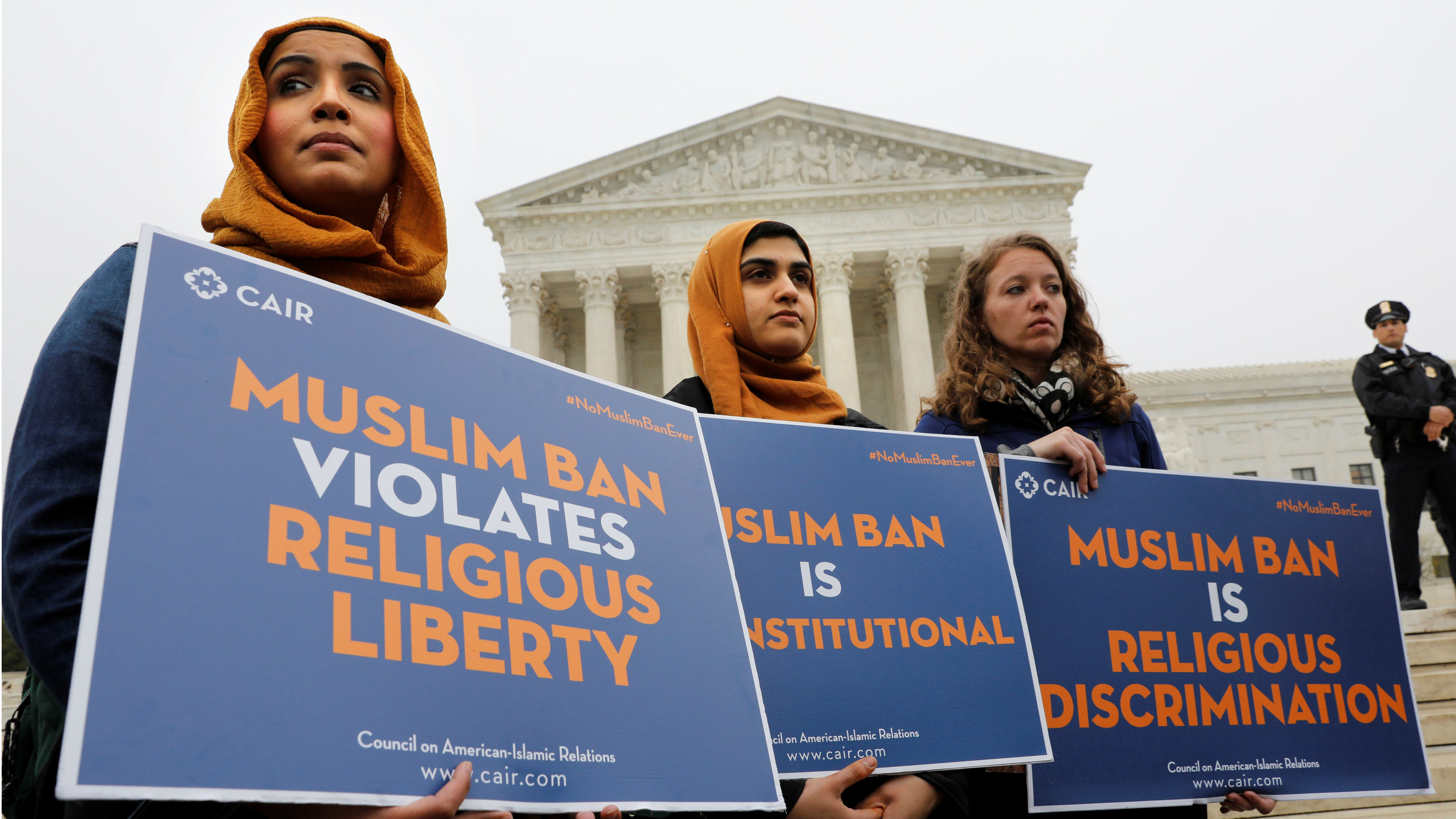 Protesters gather outside the U.S. Supreme Court in Washington, DC, U.S., April 25, 2018, while the court justices consider case regarding presidential powers as it weighs the legality of President Donald Trump's latest travel ban. Protesters gather outside the U.S. Supreme Court in Washington, DC, U.S., April 25, 2018, while the court justices consider case regarding presidential powers as it weighs the legality of President Donald Trump's latest travel ban.