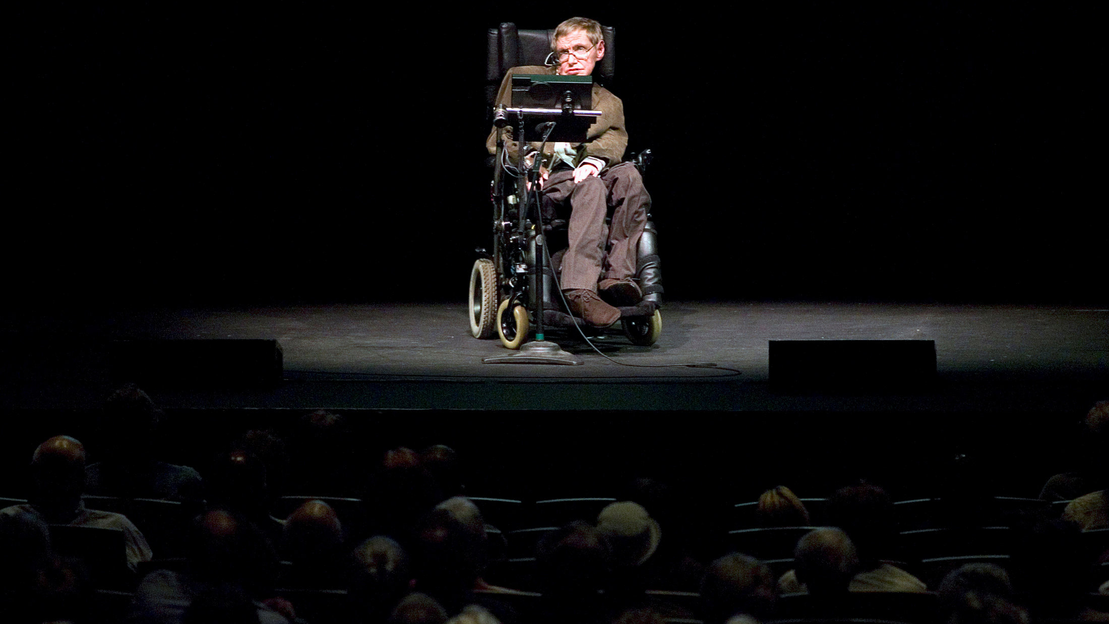Stephen Hawking onstage discussing theories on the origin of the universe in a talk in Berkeley, California, 2007. Stephen Hawking onstage discussing theories on the origin of the universe in a talk in Berkeley, California, 2007.
