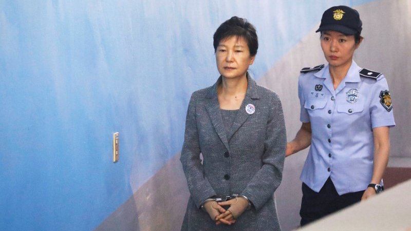 South Korean ousted leader Park Geun-hye arrives at a court in Seoul, South Korea. South Korean ousted leader Park Geun-hye arrives at a court in Seoul in handcuffs and escorted by a police officer.