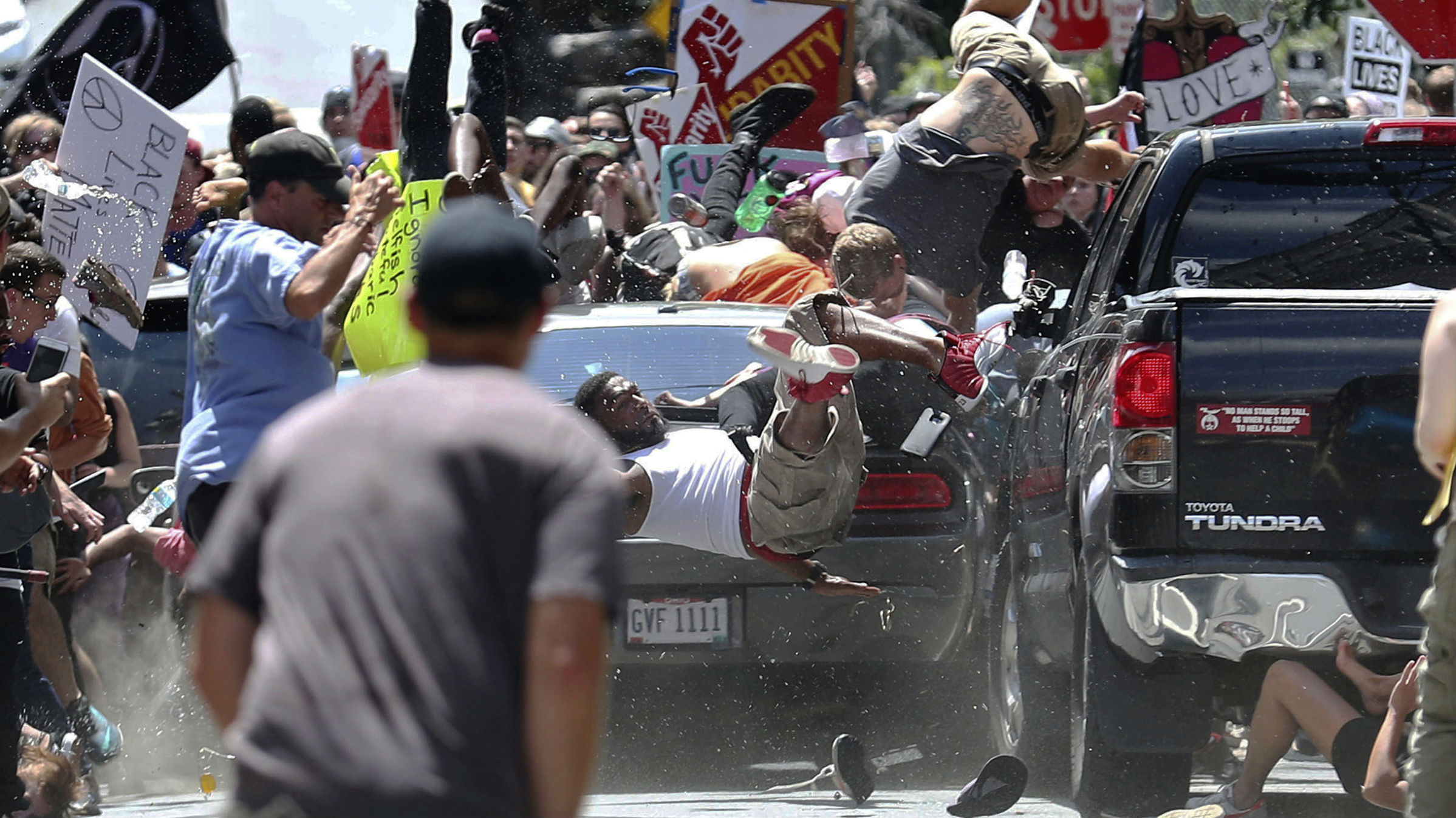 People fly into the air as a vehicle is driven into a group of protesters demonstrating against a white nationalist rally in Charlottesville, Virginia, in August 2017. People fly into the air as a vehicle is driven into a group of protesters demonstrating against a white nationalist rally in Charlottesville, Virginia, in August 2017.