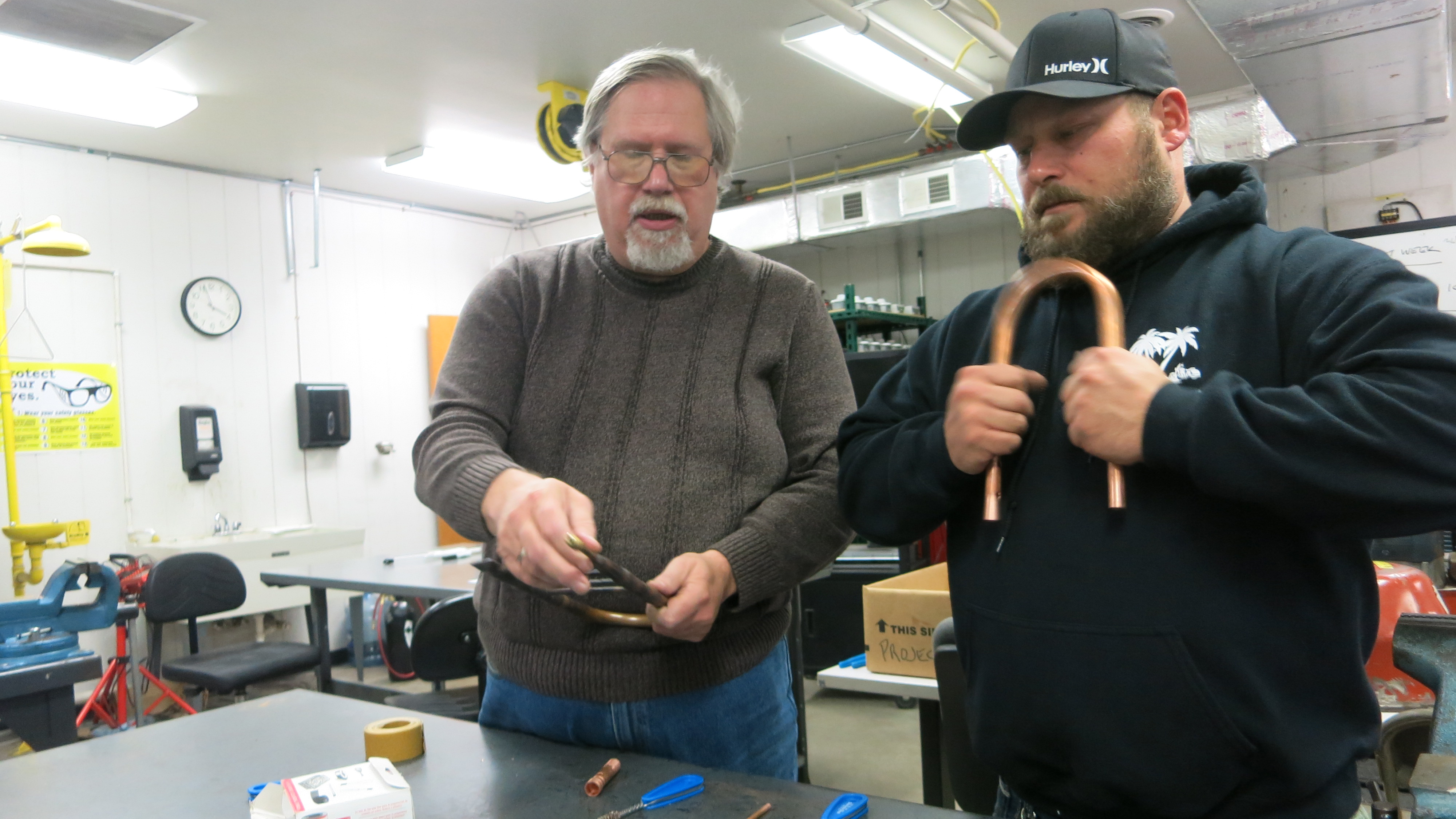HVAC Instructor Dennis Matney (left) teaches Travis Keppen how to repair pipes in a classroom in Burns Harbor, Indiana. HVAC Instructor Dennis Matney (left) teaches Travis Keppen how to repair pipes in a classroom in Burns Harbor, Indiana.