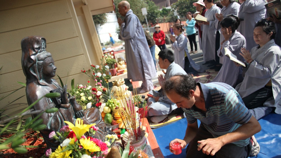 Vietnamese immigrants pray to a small shrine erected five years ago. The area was once littered, covered in graffiti, and a frequent stop for the city's public works department. But after one neighborhood resident placed the statue on the corner, local Vi Vietnamese immigrants pray to a small shrine erected five years ago. The area was once littered, covered in graffiti, and a frequent stop for the city's public works department. But after one neighborhood resident placed the statue on the corner, local Vi