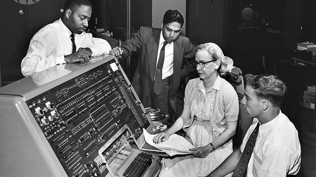 Grace Hopper Grace Hopper sits behind the UNIVAC (universal automatic computer) keyboard in the early '60s. As a mathematician and rear admiral in the US Navy, she helped design the UNIVAC I and many other related systems.