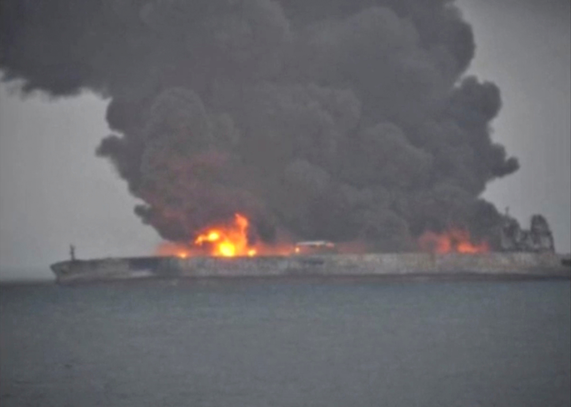 Smoke and fire is seen from the oil tanker Sanchi after it collided with a Chinese freight ship in the East China Sea, Jan. 7, 2018. Smoke and fire is seen from the oil tanker Sanchi after it collided with a Chinese freight ship in the East China Sea, Jan. 7, 2018.