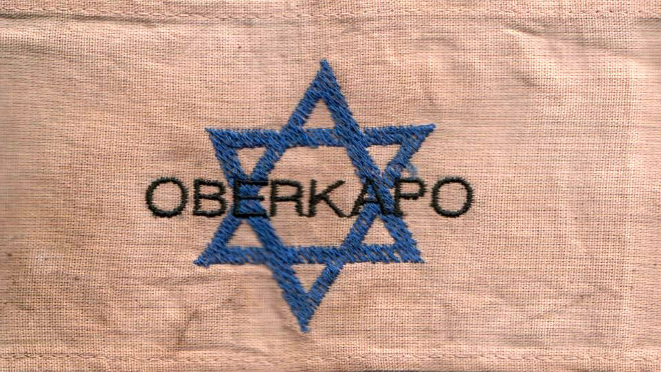 The armband of a chief kapo, or "oberkapo" in a Nazi concentration camp The armband of a chief kapo, or "oberkapo" in a Nazi concentration camp