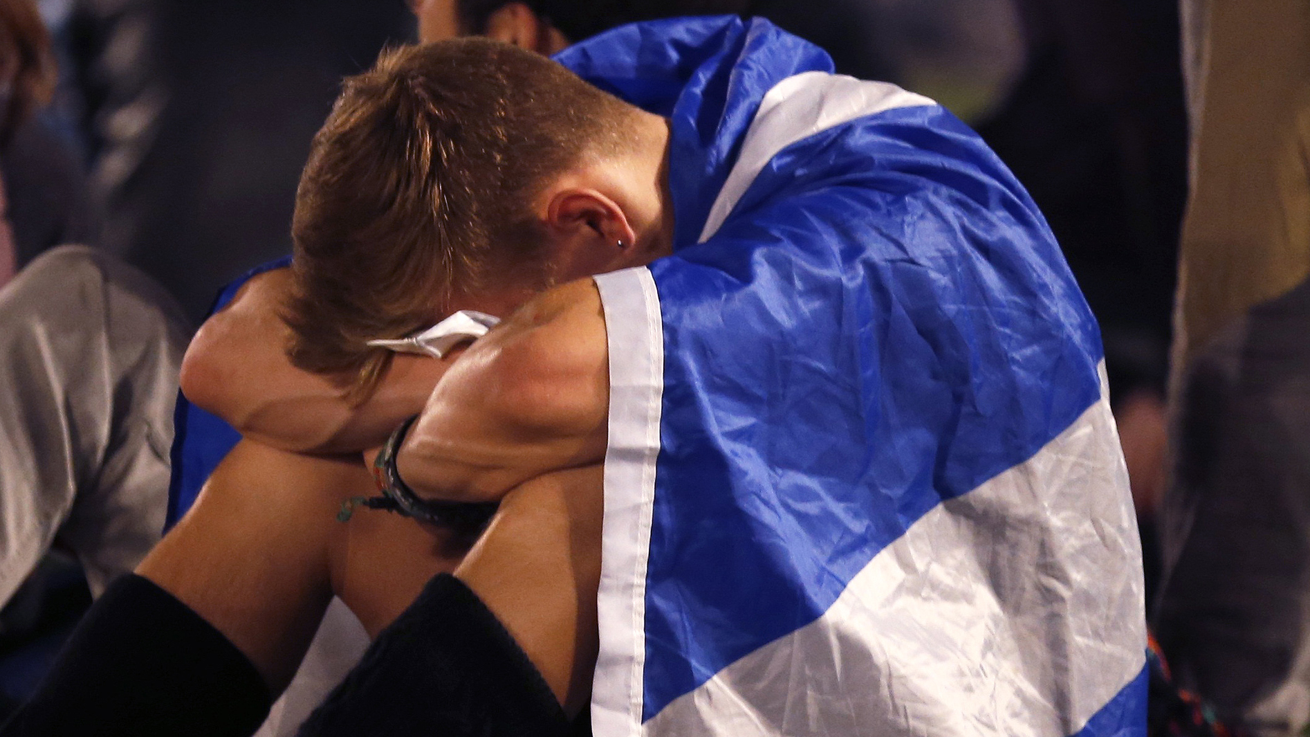 A supporter from the "Yes" Campaign cries into his knees as he sits in George Square in Glasgow, Scotland September 19, 2014. The "Yes" Campaign bid to win independence for Scotland, failed. A supporter from the "Yes" Campaign cries into his knees as he sits in George Square in Glasgow, Scotland September 19, 2014. The "Yes" Campaign bid to win independence for Scotland, failed.