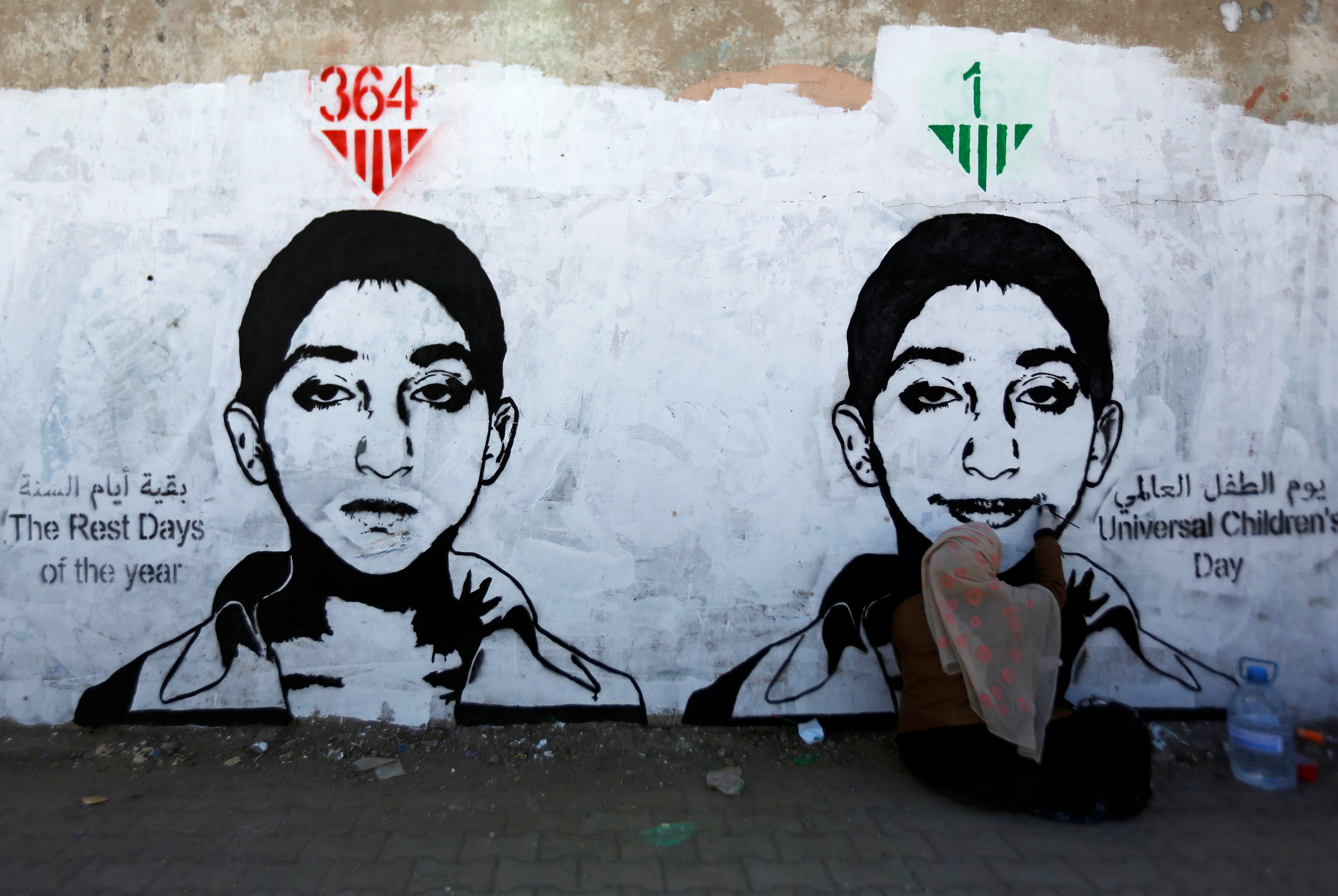 Artist Haifa Subay paints a mural about children's suffering in a time of war, part of the 'Silent Victims' campaign in Sanaa, Yemen Artist Haifa Subay paints a mural about children's suffering in a time of war, part of the 'Silent Victims' campaign in Sanaa, Yemen