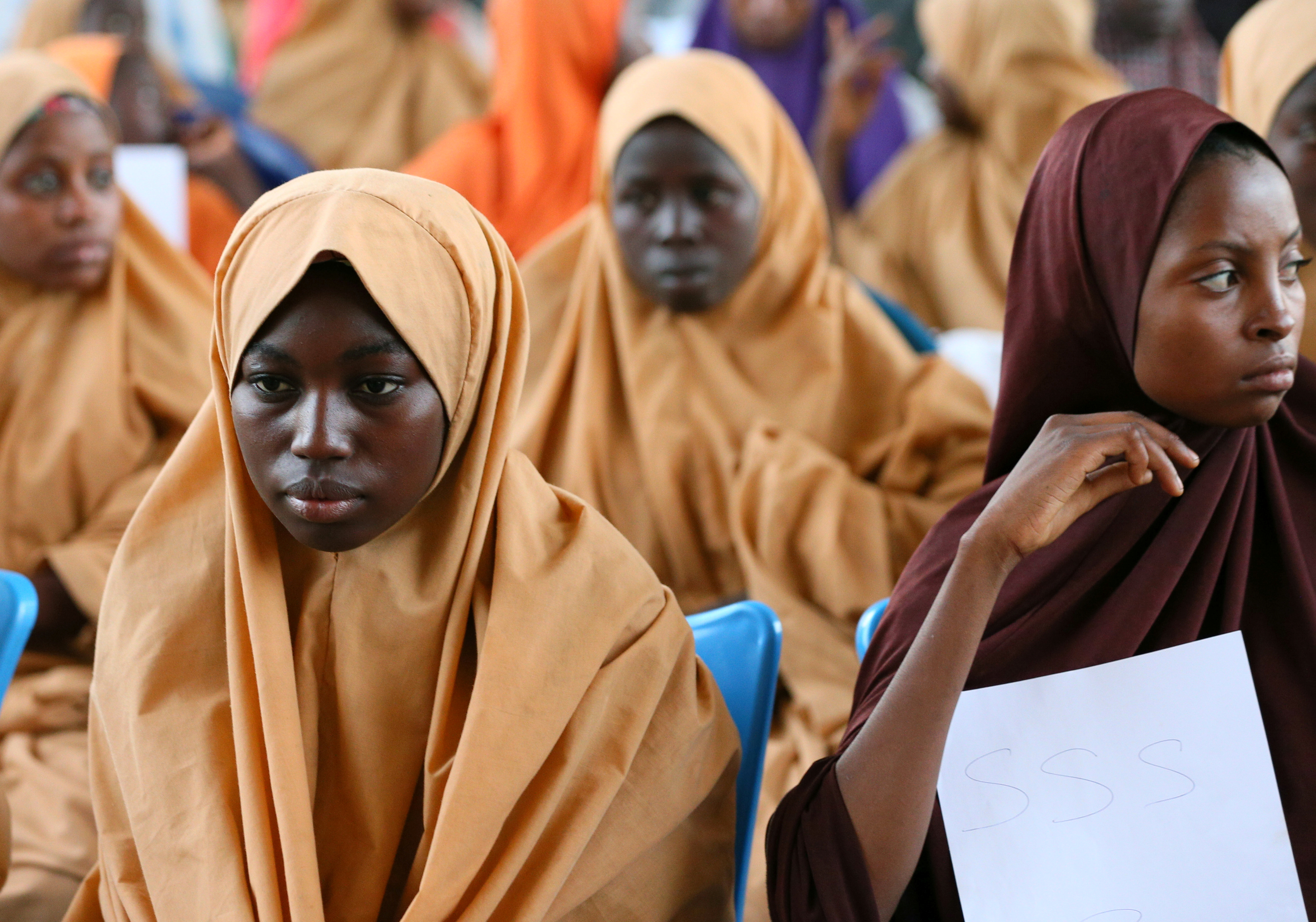 Some of the newly-released Dapchi schoolgirls wait to board a plane at the air force base in Maiduguri. Some of the newly-released Dapchi schoolgirls wait to board a plane at the air force base in Maiduguri.