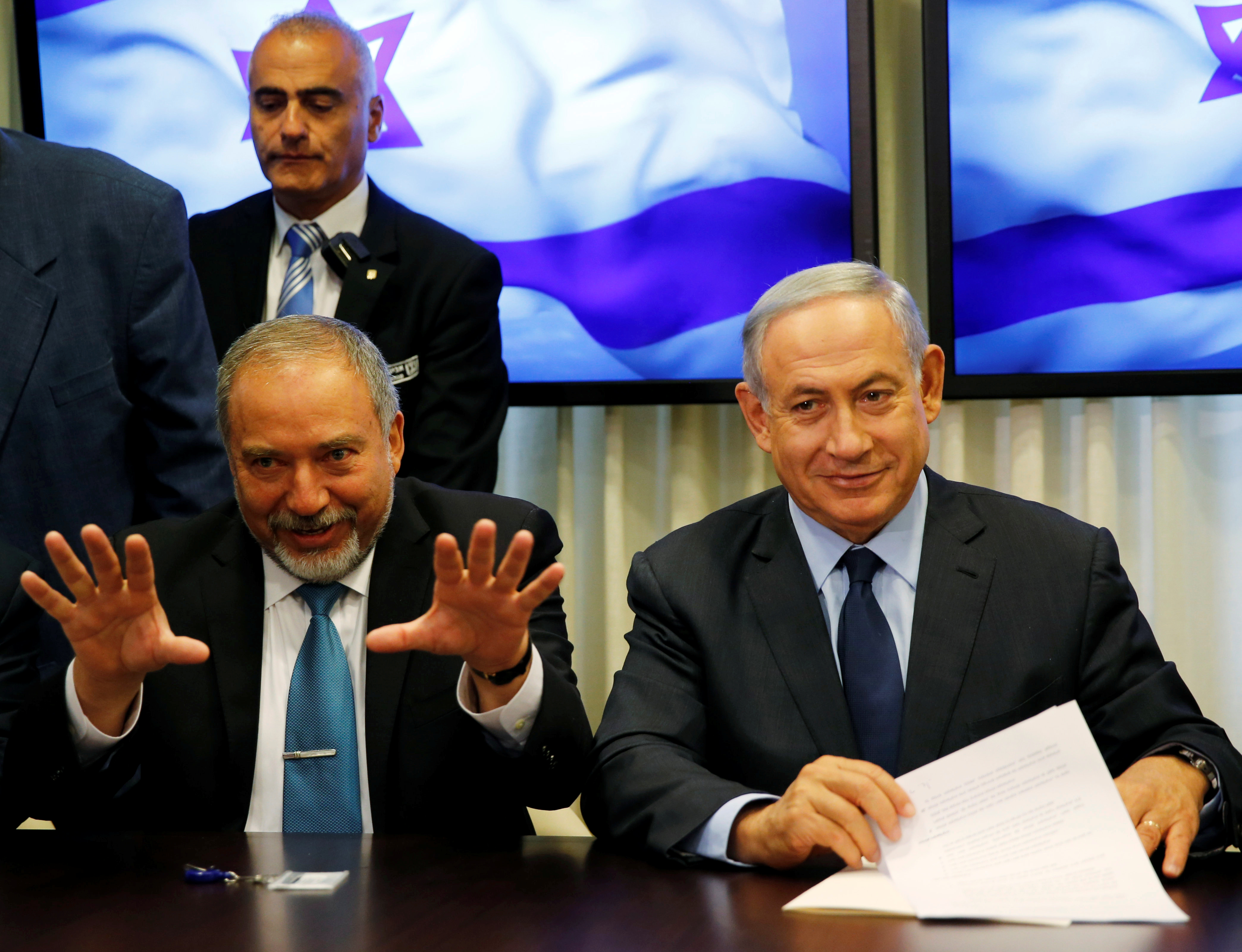 Israel's new defense minister, Avigdor Lieberman, left, next to Israeli Prime Minister Benjamin Netanyahu as they sign a coalition deal to broaden the government's parliamentary majority on May 25. Israel's new defense minister, Avigdor Lieberman, left, next to Israeli Prime Minister Benjamin Netanyahu as they sign a coalition deal to broaden the government's parliamentary majority on May 25.