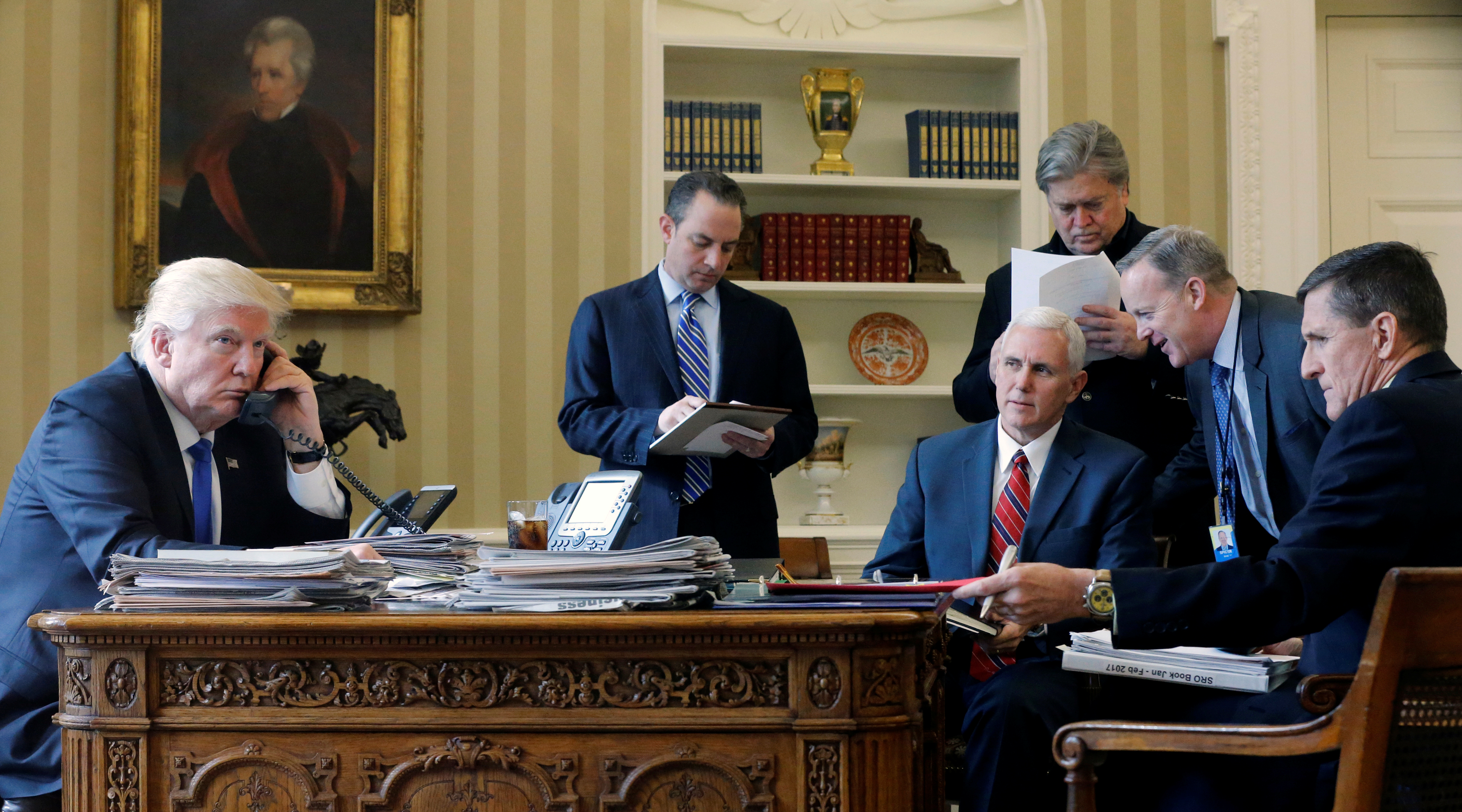 President Donald Trump and aid at the Oval Office in the White House. President Donald Trump and aid at the Oval Office in the White House.