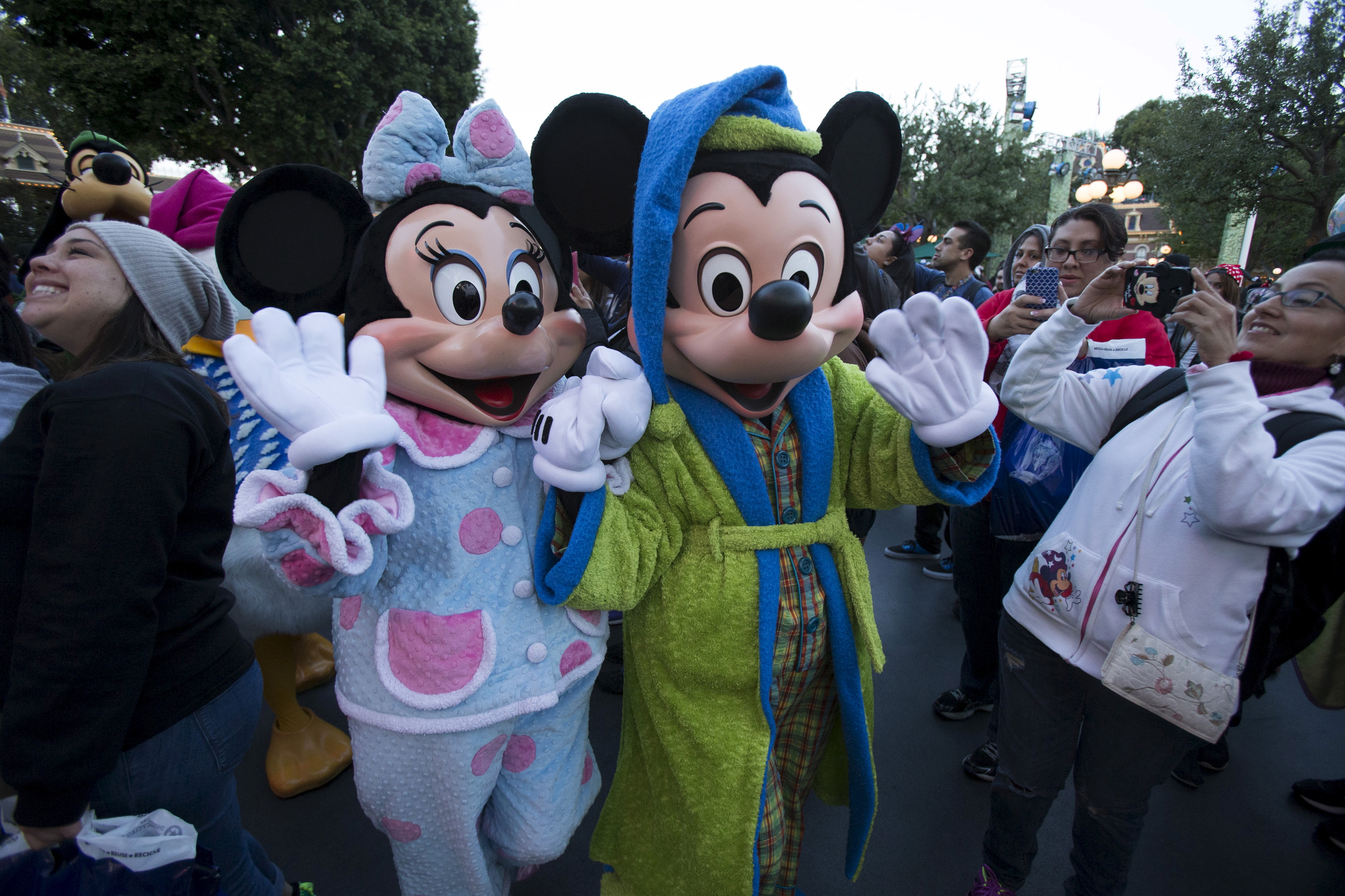 The characters of Mickey Mouse and Minnie Mouse greet guests during Disneyland's Diamond Celebration in Anaheim, California May 23, 2015. The characters of Mickey Mouse and Minnie Mouse greet guests during Disneyland's Diamond Celebration in Anaheim, California May 23, 2015.