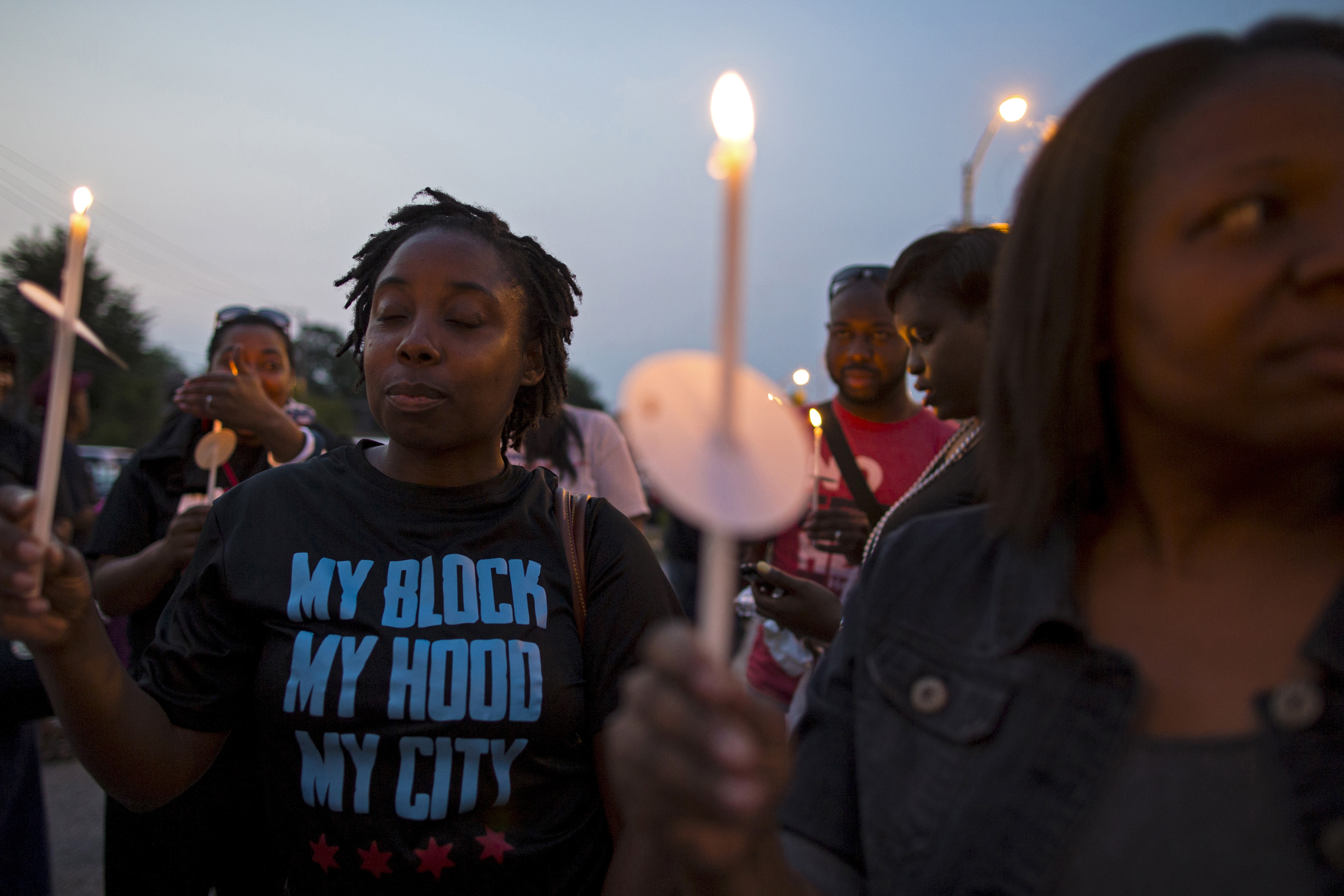 Residents of Chicago's Englewood neighborhood gather for a candlelight vigil against gun violence. Residents of Chicago's Englewood neighborhood gather for a candlelight vigil against gun violence.