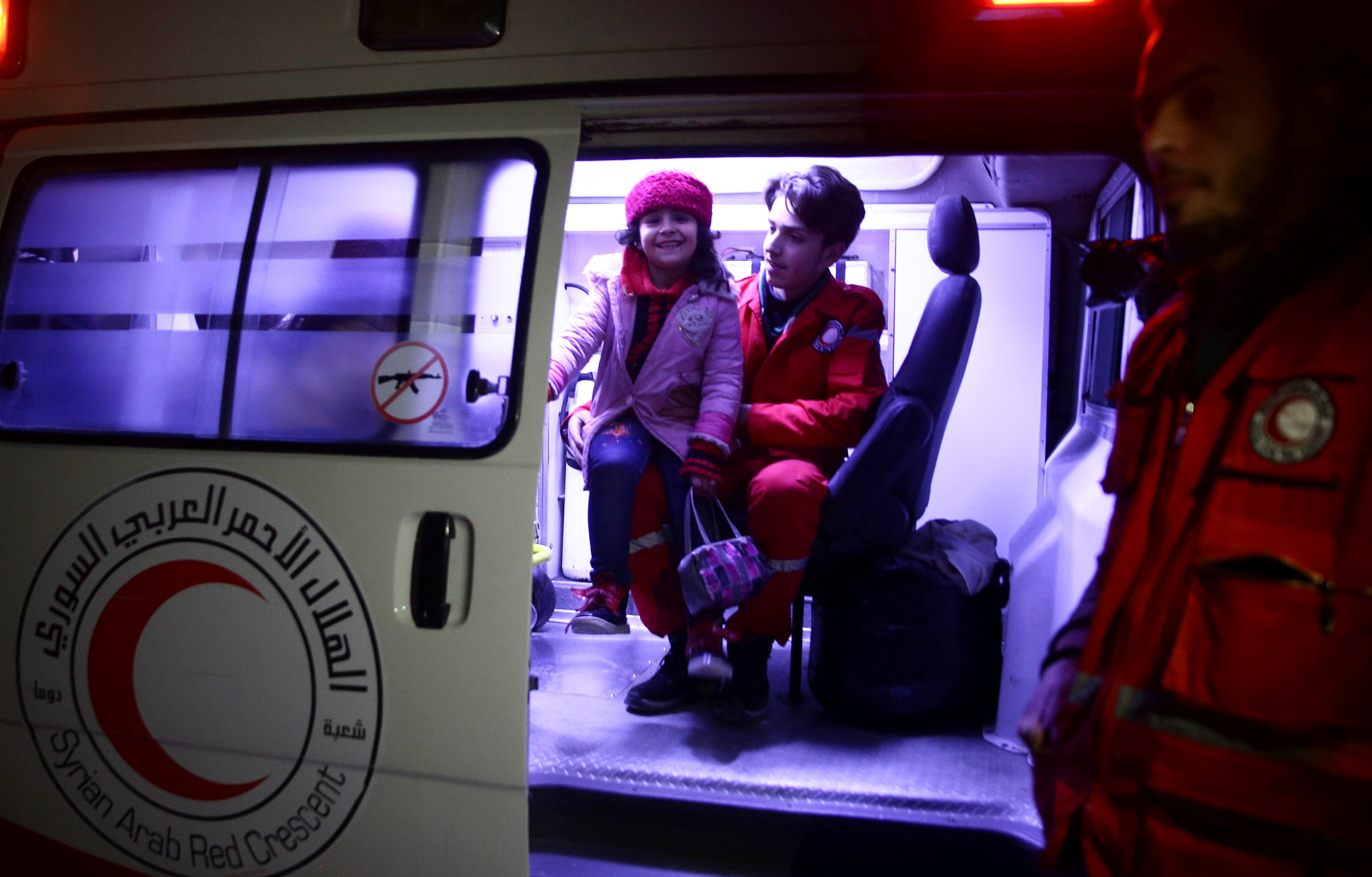 A girl is seen in an ambulance during medical evacuation from eastern Ghouta late Tuesday. A girl is seen in an ambulance during medical evacuation from eastern Ghouta late Tuesday.
