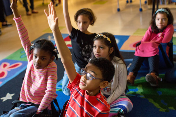 Raised hands at school
