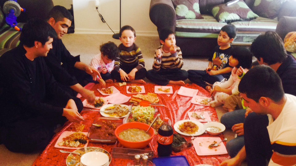 The families of former Afghan interpreters Janis Shanwari and Ajmal Faqiri gather for a holiday lunch on Thursday. The families of former Afghan interpreters Janis Shanwari and Ajmal Faqiri gather for a holiday lunch on Thursday.