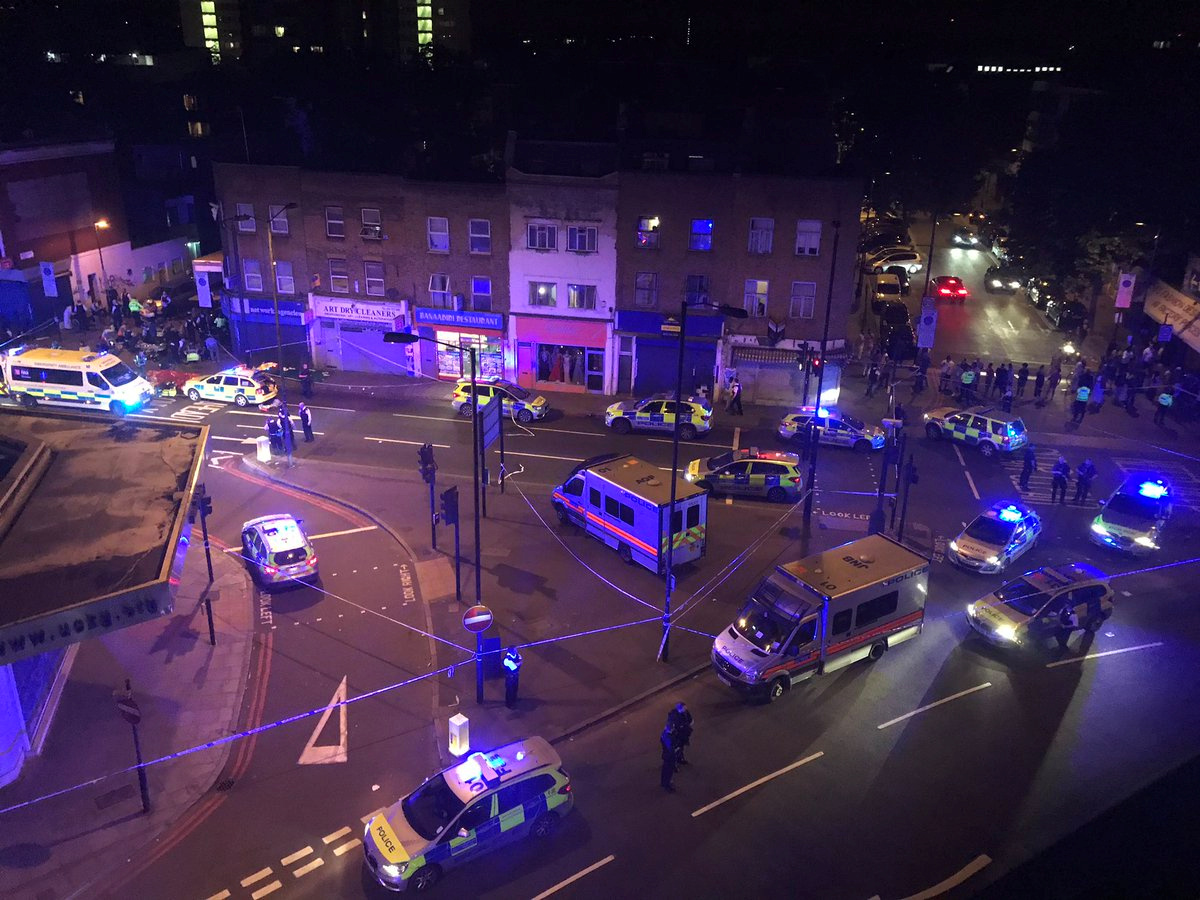 Police officers attend to the scene after a vehicle collided with pedestrians in the Finsbury Park neighborhood of North London, Britain, June 19, 2017.
