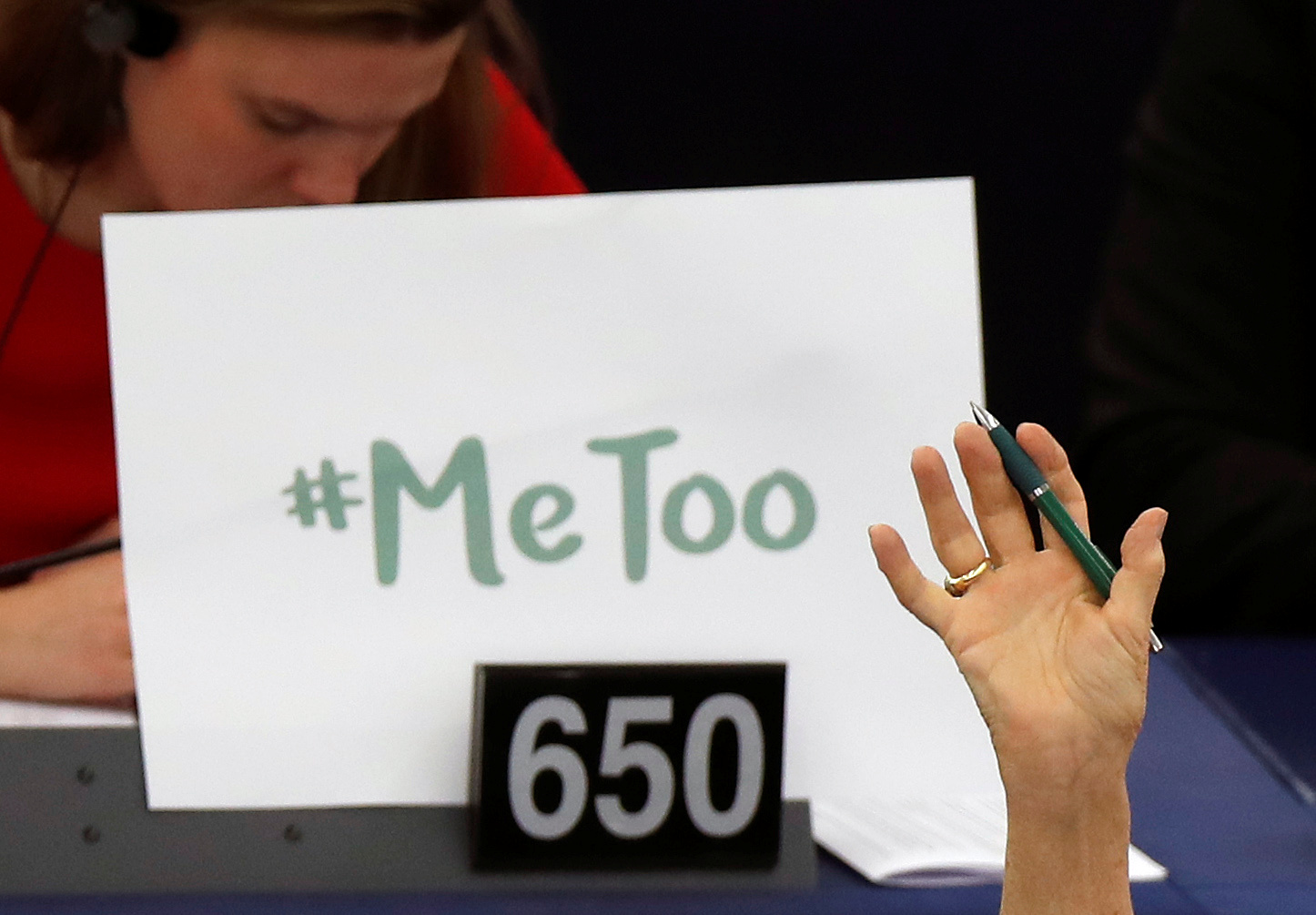 The sign #MeToo is propped up on a European Parliament member's desk during a session to discuss preventive measures against sexual harassment and abuse. The sign #MeToo is propped up on a European Parliament member's desk during a session to discuss preventive measures against sexual harassment and abuse.
