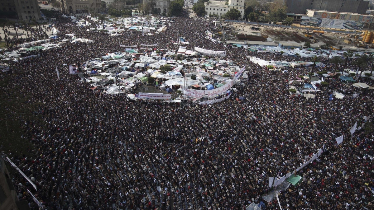 In this Feb. 11, 2011 file photo, anti-government protesters perform Friday prayers at the continuing demonstration in Tahrir Square, Cairo, Egypt.